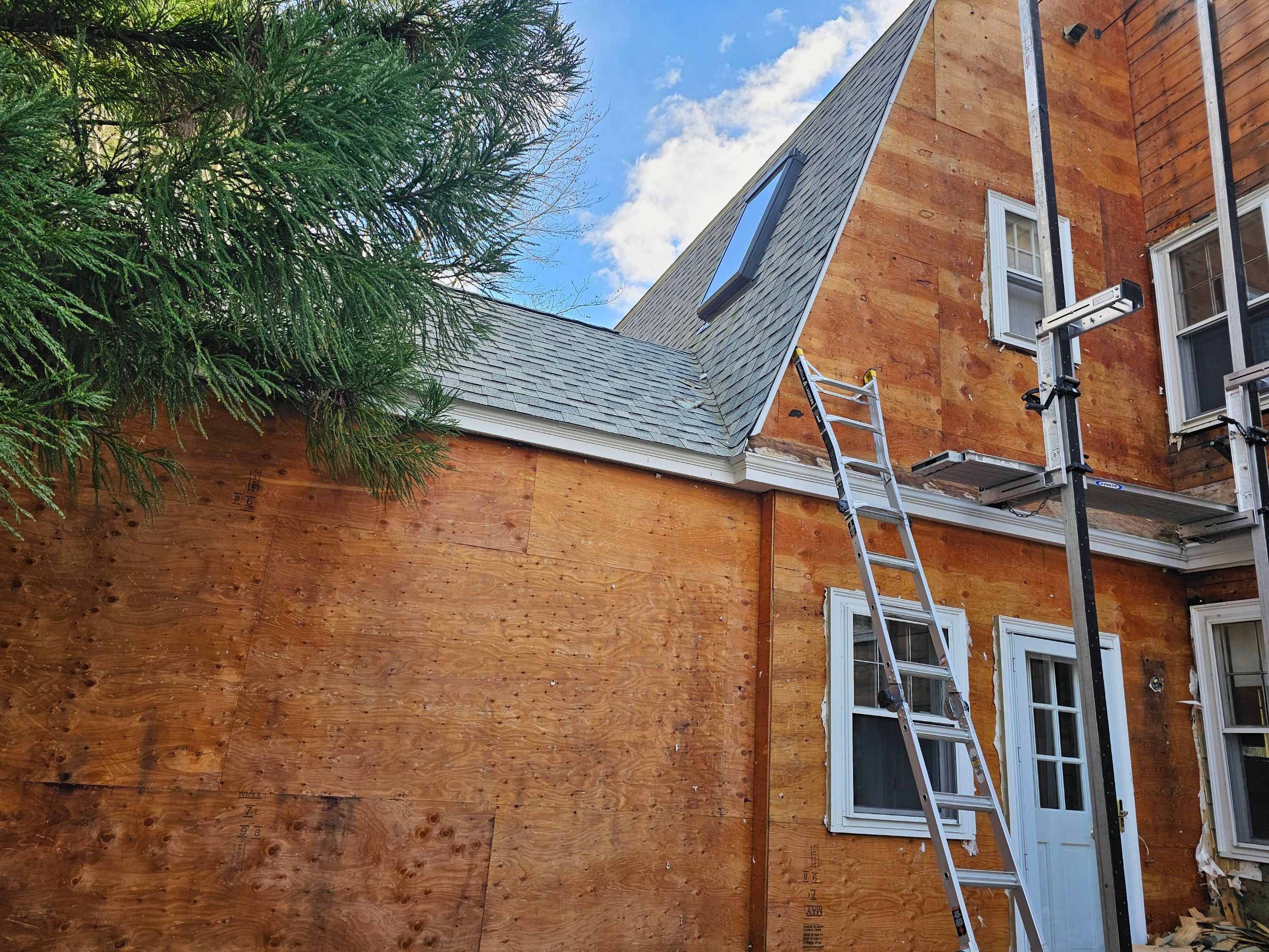 White cedar shingles and windows in Wayland, MA by UBrothers Construction