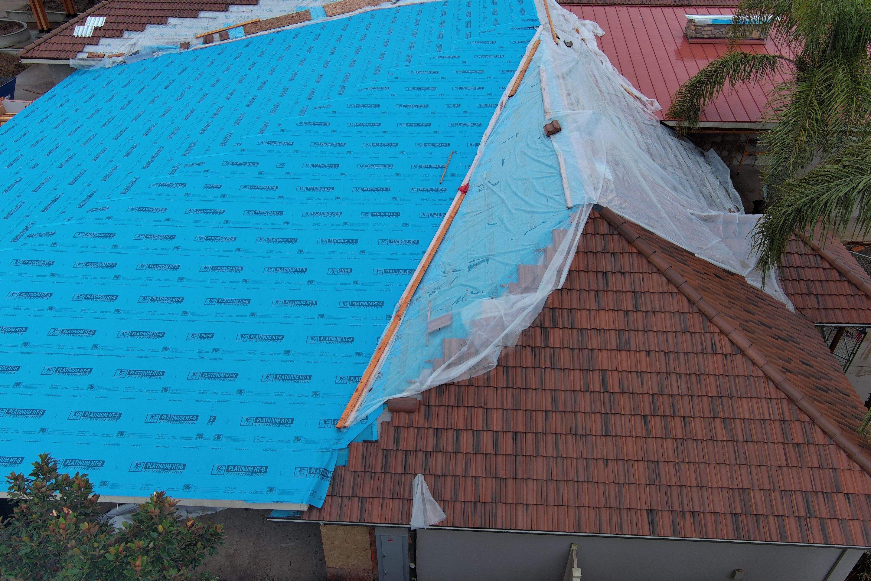 Tile, Metal, and TPO roofing project (new construction) by Straight Edge Roofing Inc
