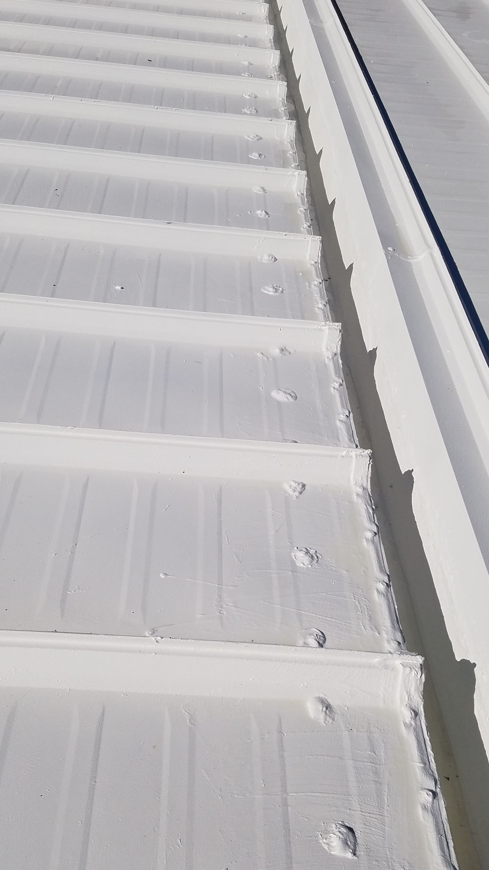 Commercial Metal Roof Coating by Gold Star Roofing LLC