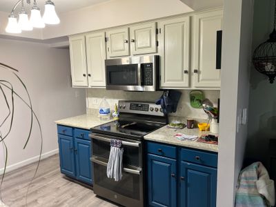 Two-Tone Kitchen Cabinet Refinishing and Granite Countertop Installation
