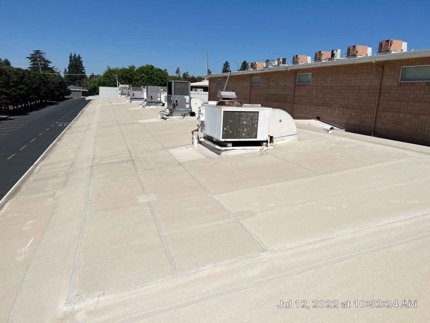 MR Roofing system using Benchmark/PUMA XL coatings over TPO single-ply roofing by Straight Edge Roofing Inc