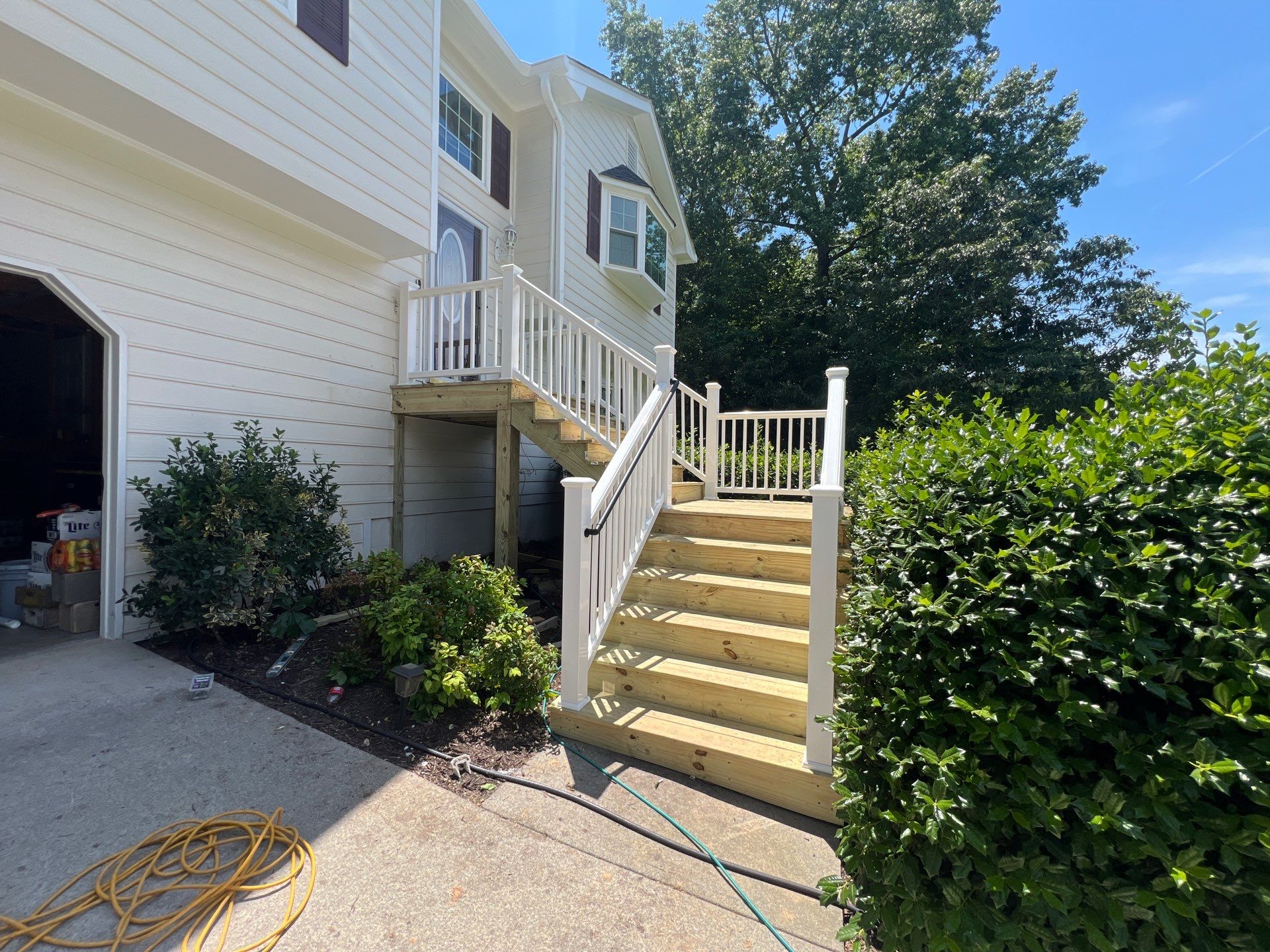 Front Entrance Deck Stair Replacement with White Vinyl Railings in Lawrenceville by Swift Home Renovations