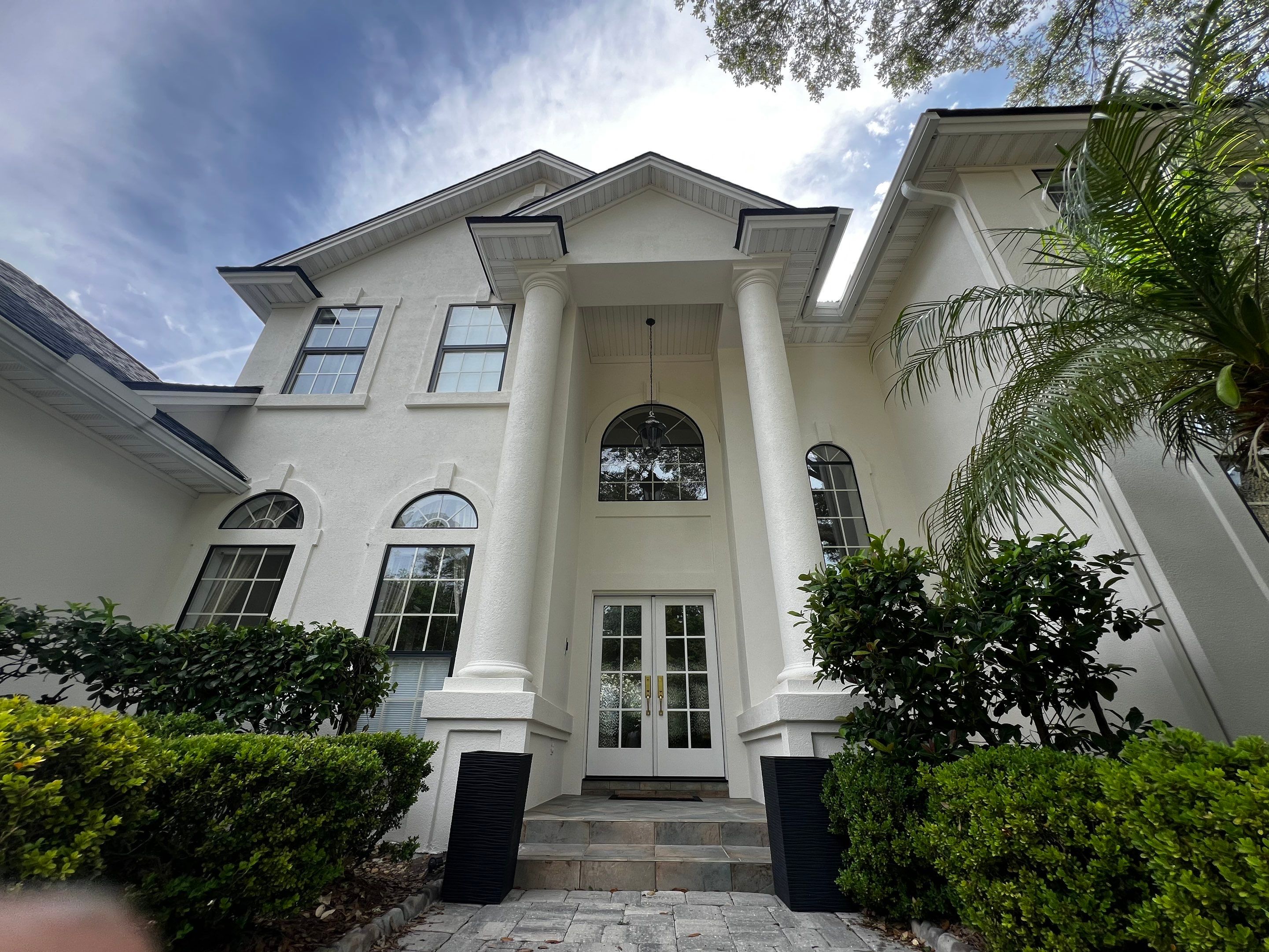 Large Stucco Home Exterior Painting in Marsh Landing | Ponte Vedra Beach, FL by A New Leaf Painting, LLC