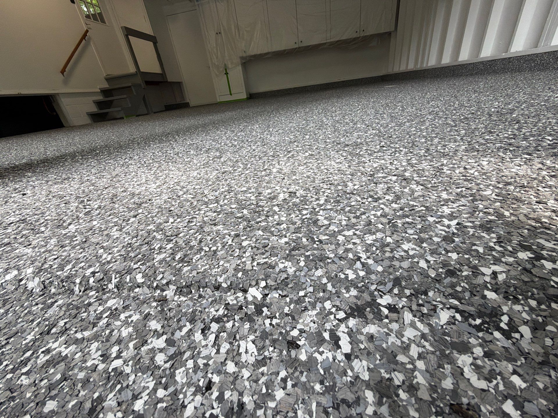 Pentwater Garage Epoxy Flake Floor Installation and Exterior Refinement by Gordon Painting