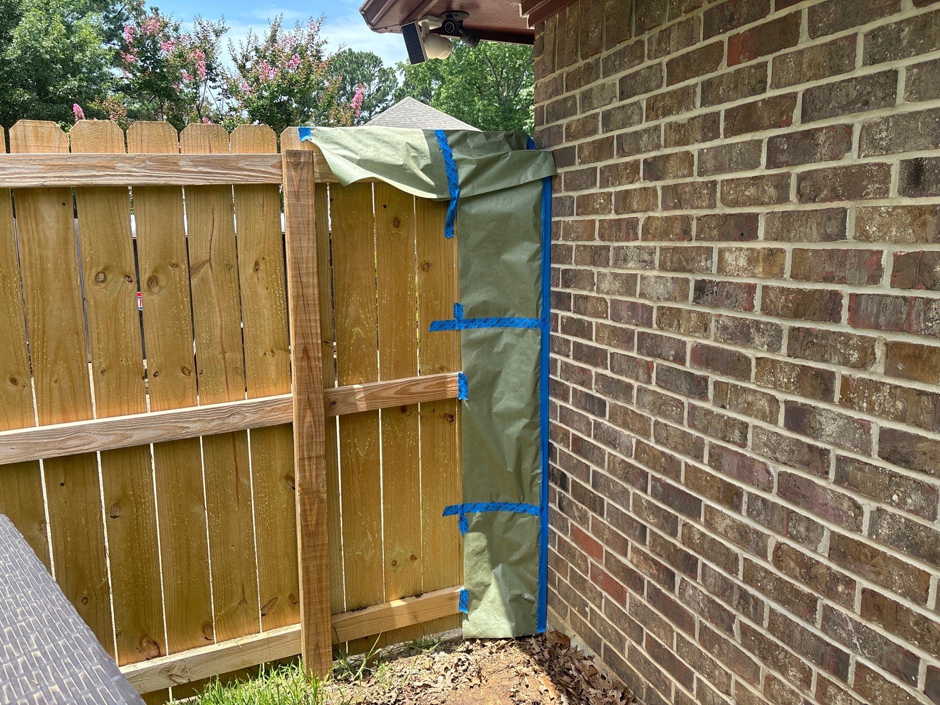 Project in TylerExterior Painting in Tyler, TX | White Brick Home, Varnished Fence & Shed Painting by Quality Coats Painting