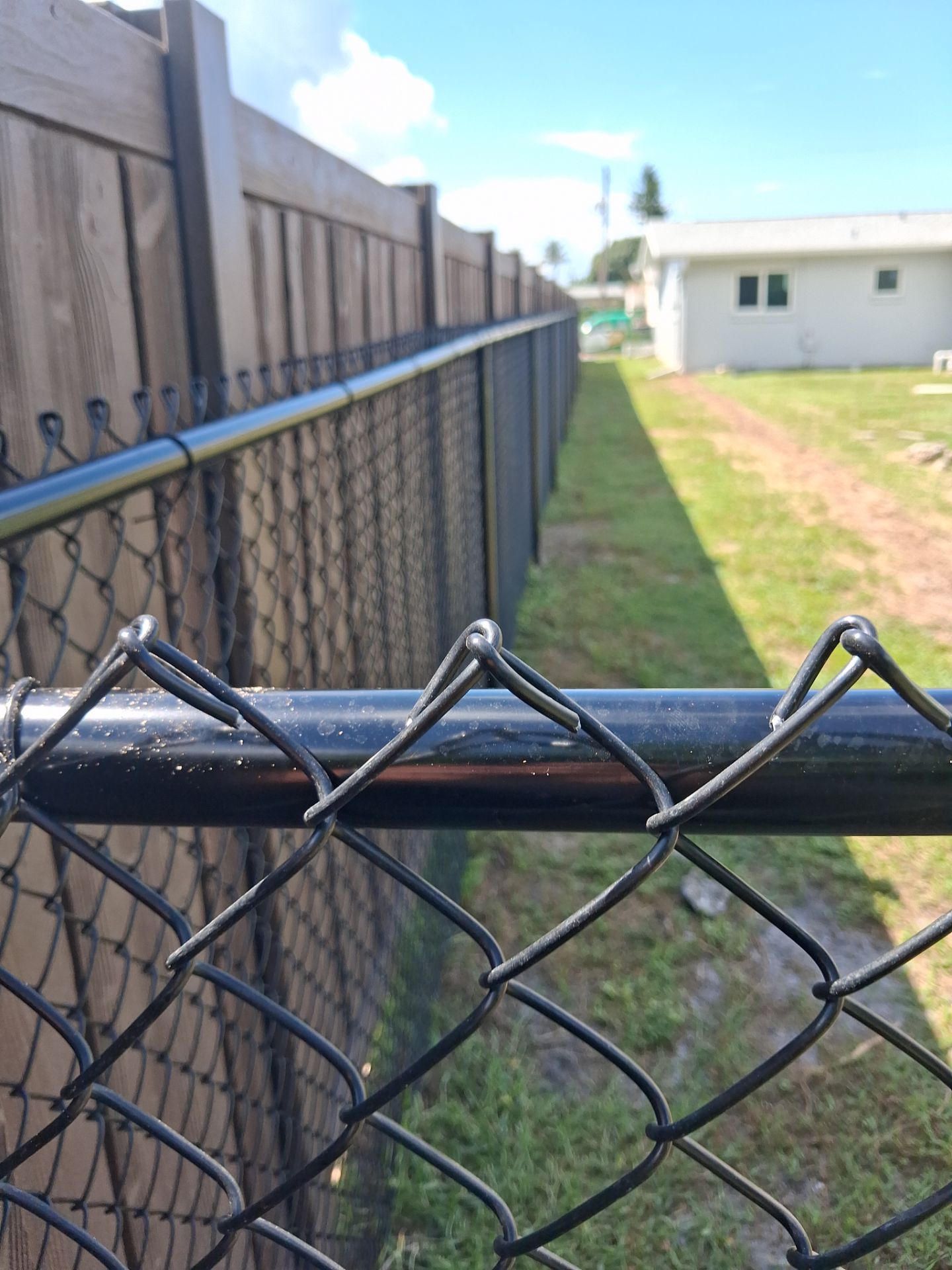 Black Chain Link Fence Installation for Residential Backyard in Port Charlotte by True Fence LLC