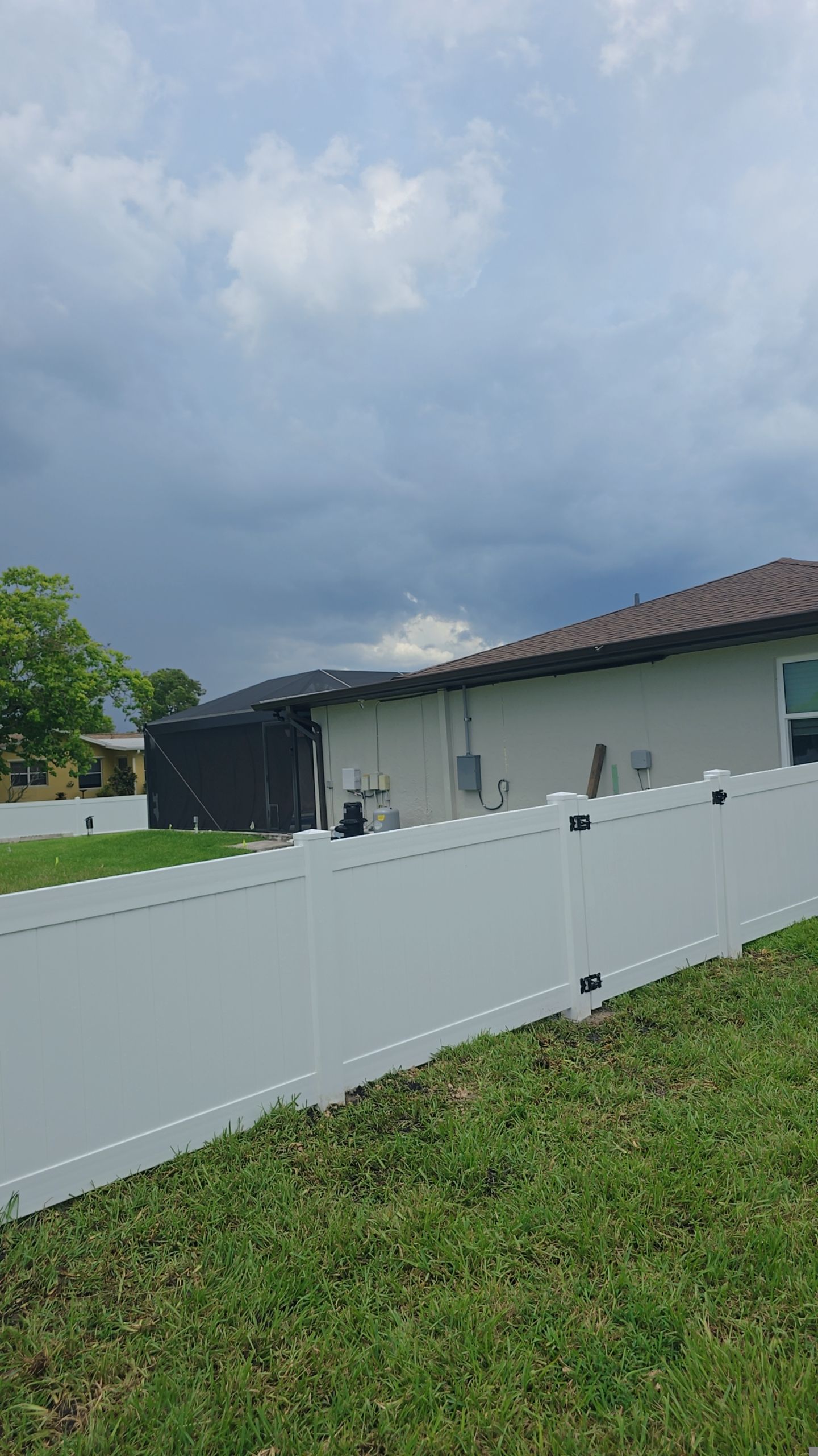 White Vinyl Privacy Fence Installation on Port Charlotte Corner Lot by True Fence LLC