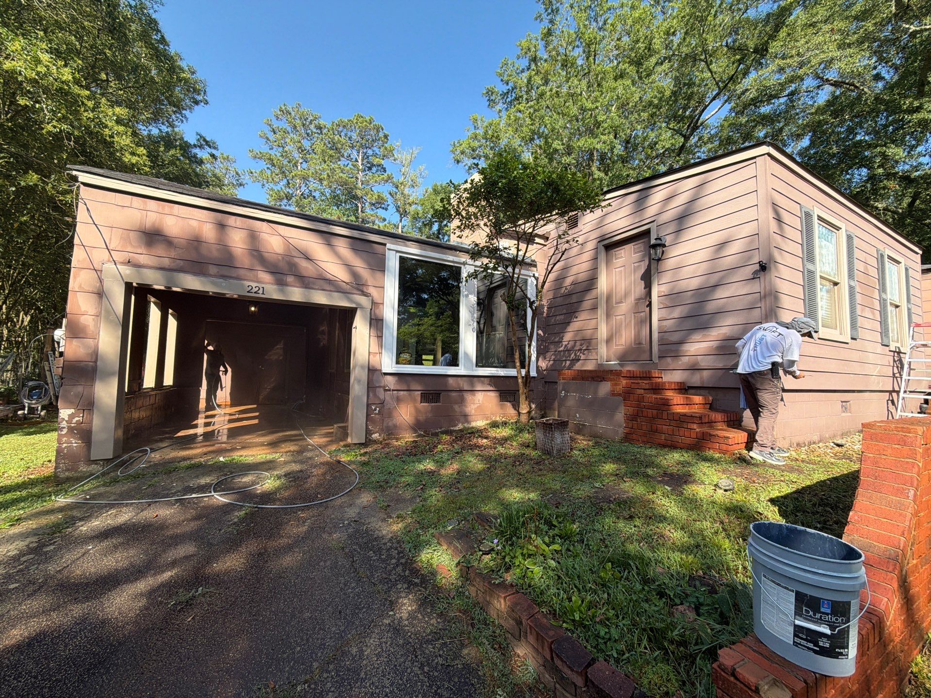 Full Exterior Repaint with Navy Blue and White Trim by Swift Home Renovations