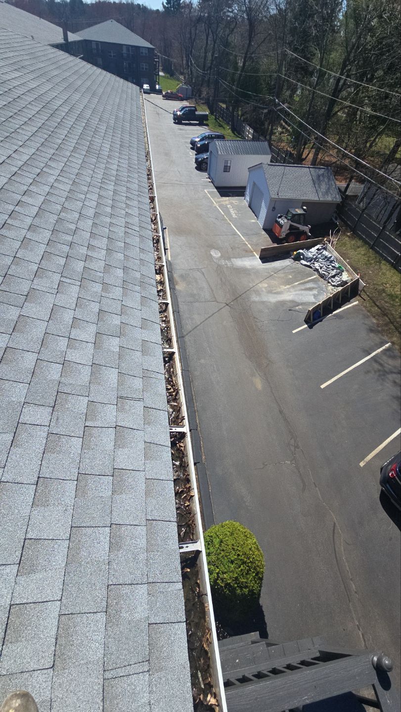 Commercial gutter cleaning Boston, MA before photo with filled gutters