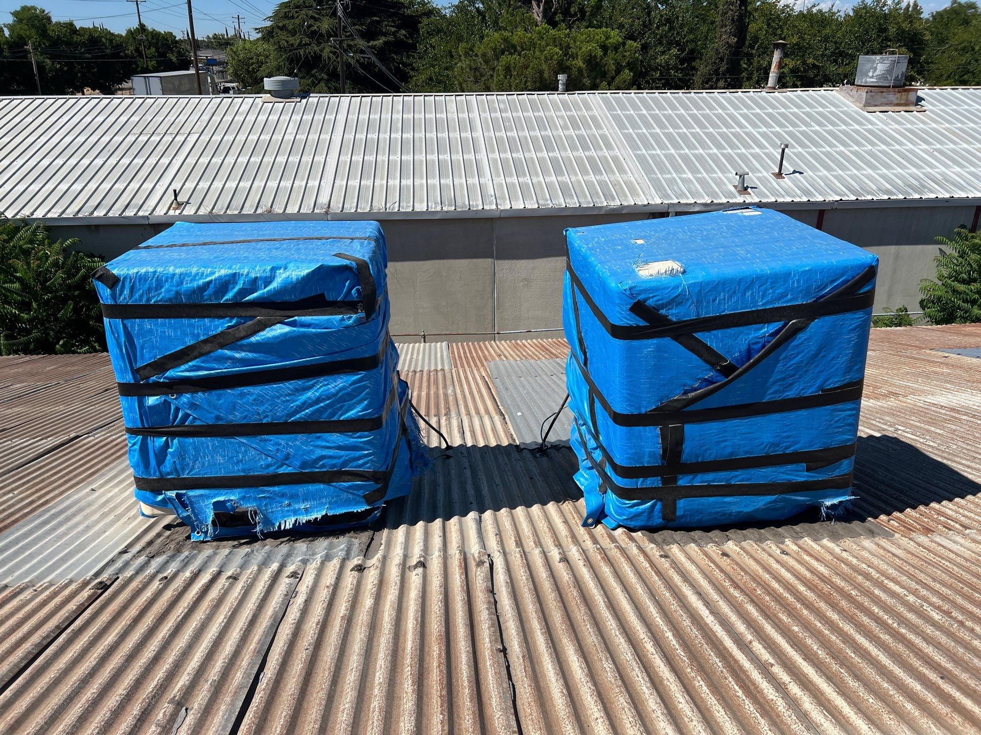 Spray foam and coatings using Conklin Benchmark/ PUMA XL acrylic coatings over metal and foam by Straight Edge Roofing Inc