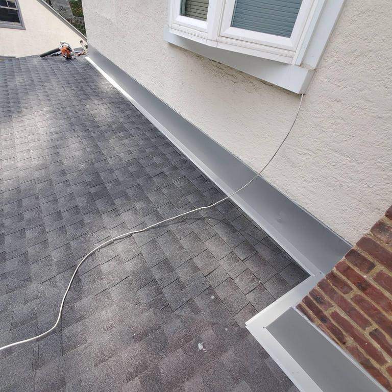 New Roof & Gutters by Island Roofing Inc.