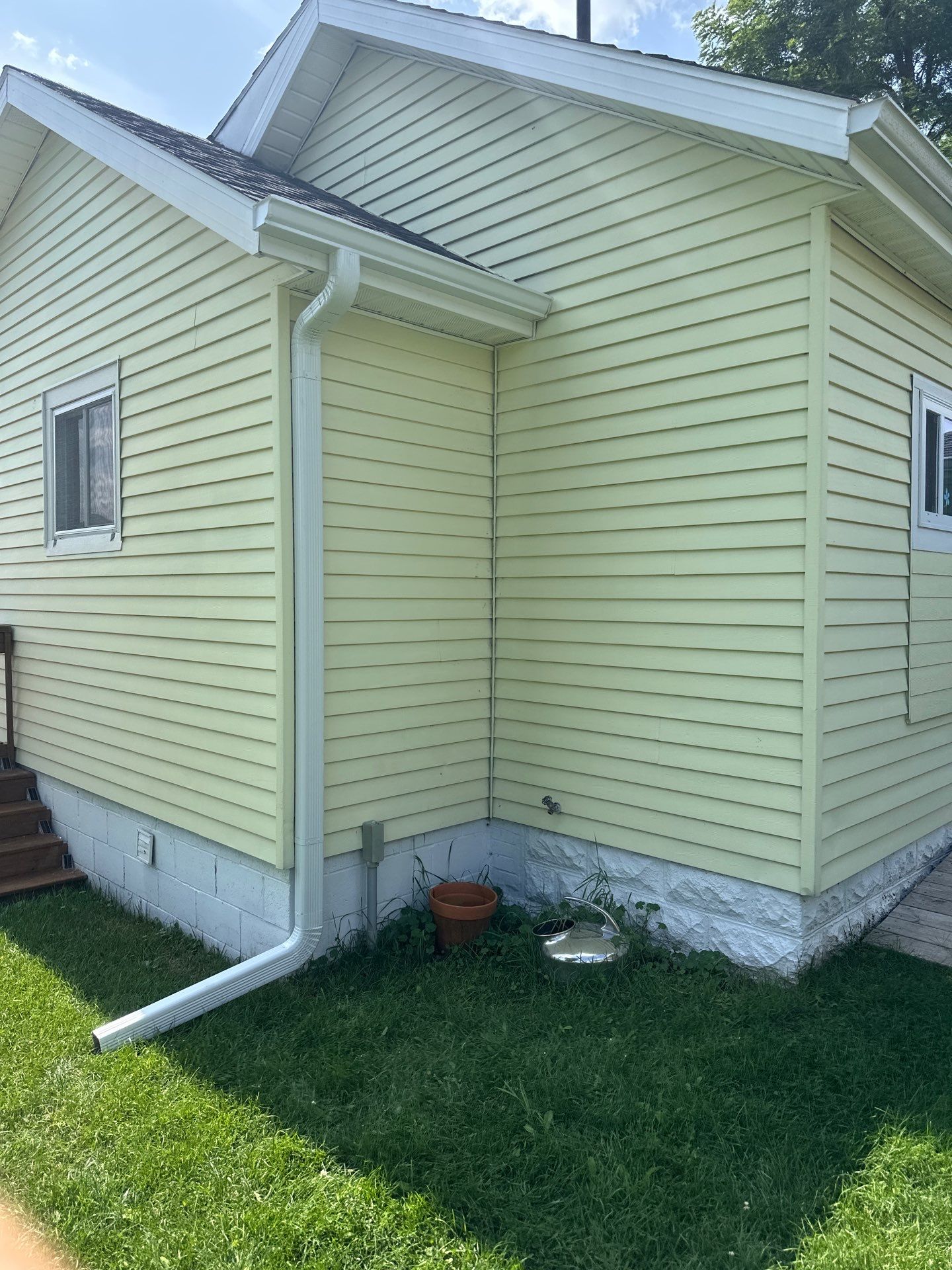 White Gutter and Downspout Installation for Lewiston Residence by Rainbow Seamless Systems