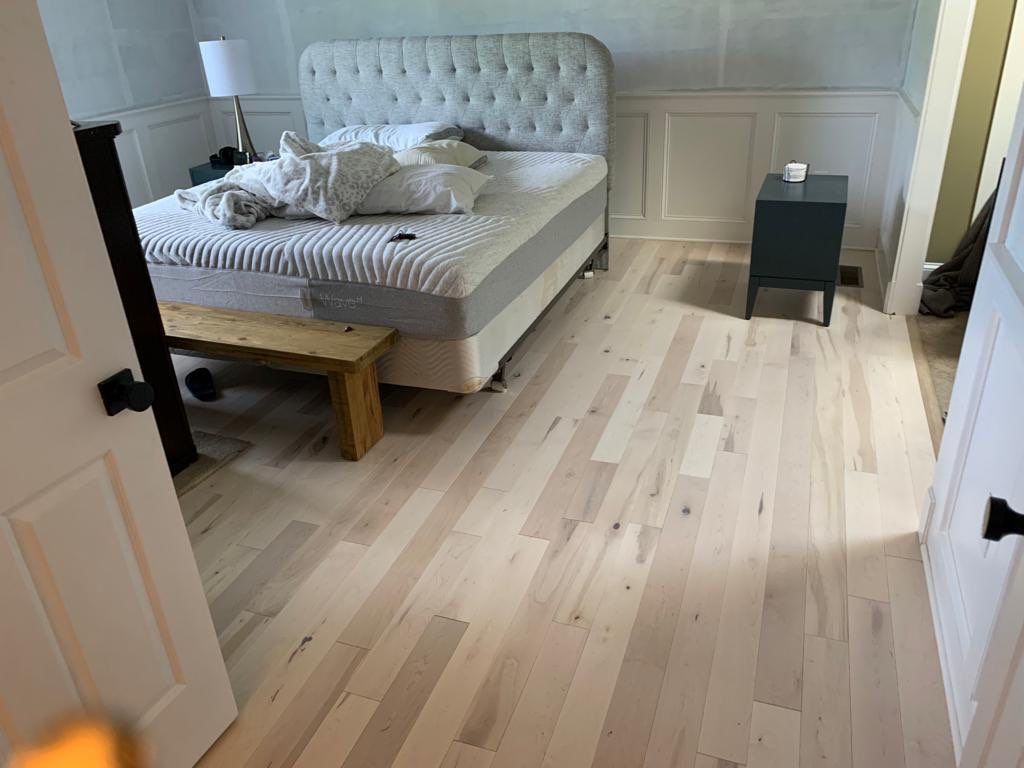 Flooring Installation using Maple Hardwood by Greenspring Construction Services