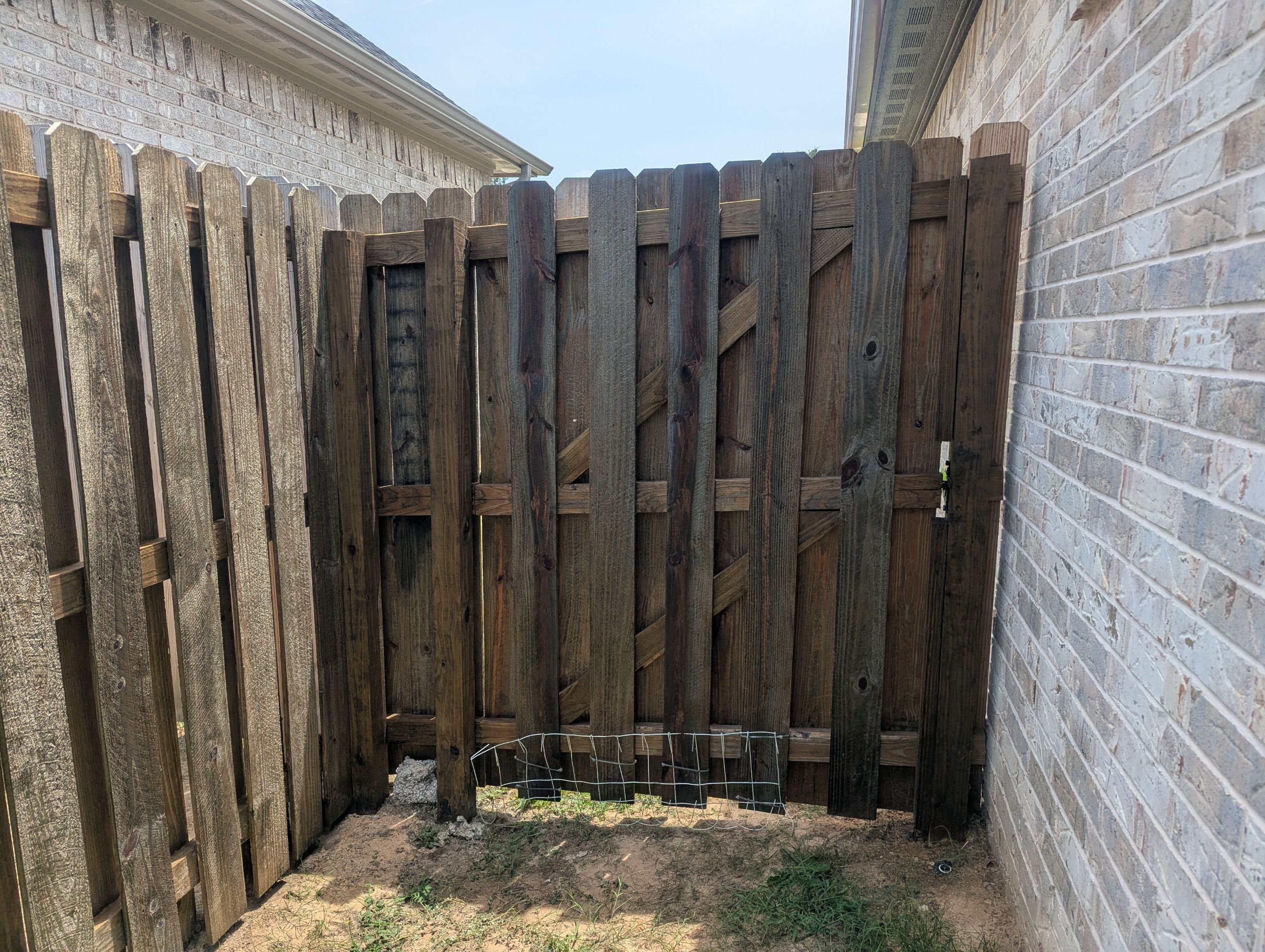 Touching Up a Fence in Whitehouse by Quality Coats Painting
