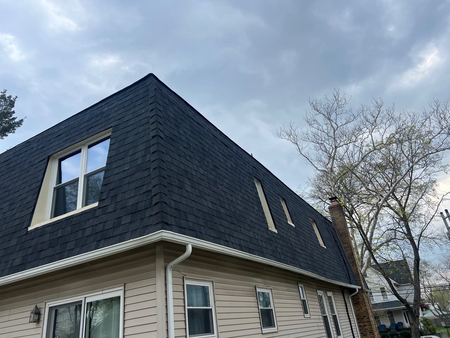 Moire Black Shingles by Reimagine Roofing