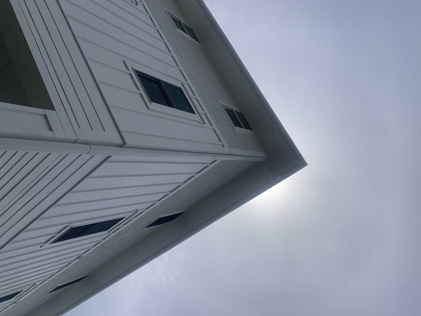 Downspout Installation for Multi-Story Building in Panama City FL by Gutter Professors