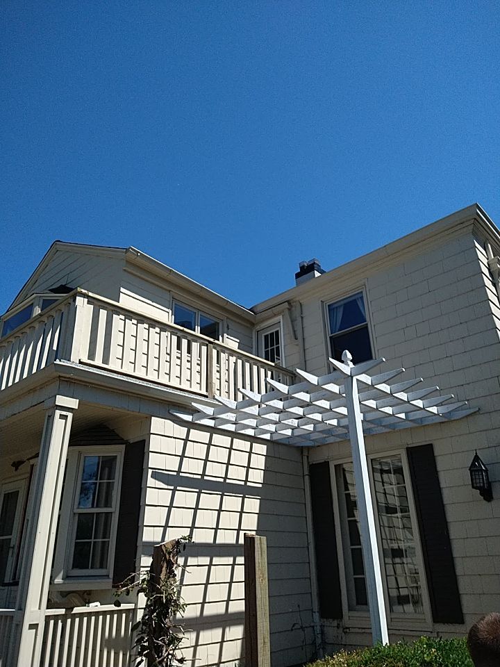 Residential Roofing Installation, Dec-tek walk-out porch roof, siding on garage by Absolute Roofing and Construction