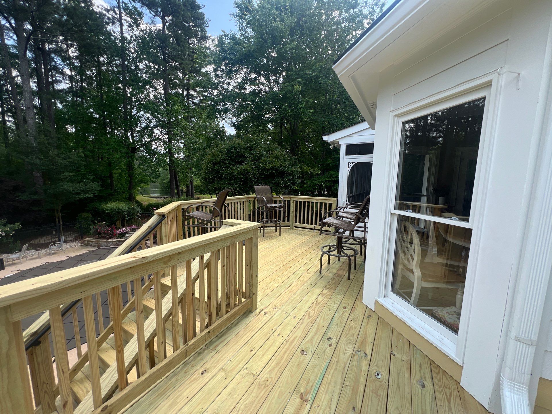 Multi-Level Pressure-Treated Wood Deck and Screened Porch in Acworth by Swift Home Renovations