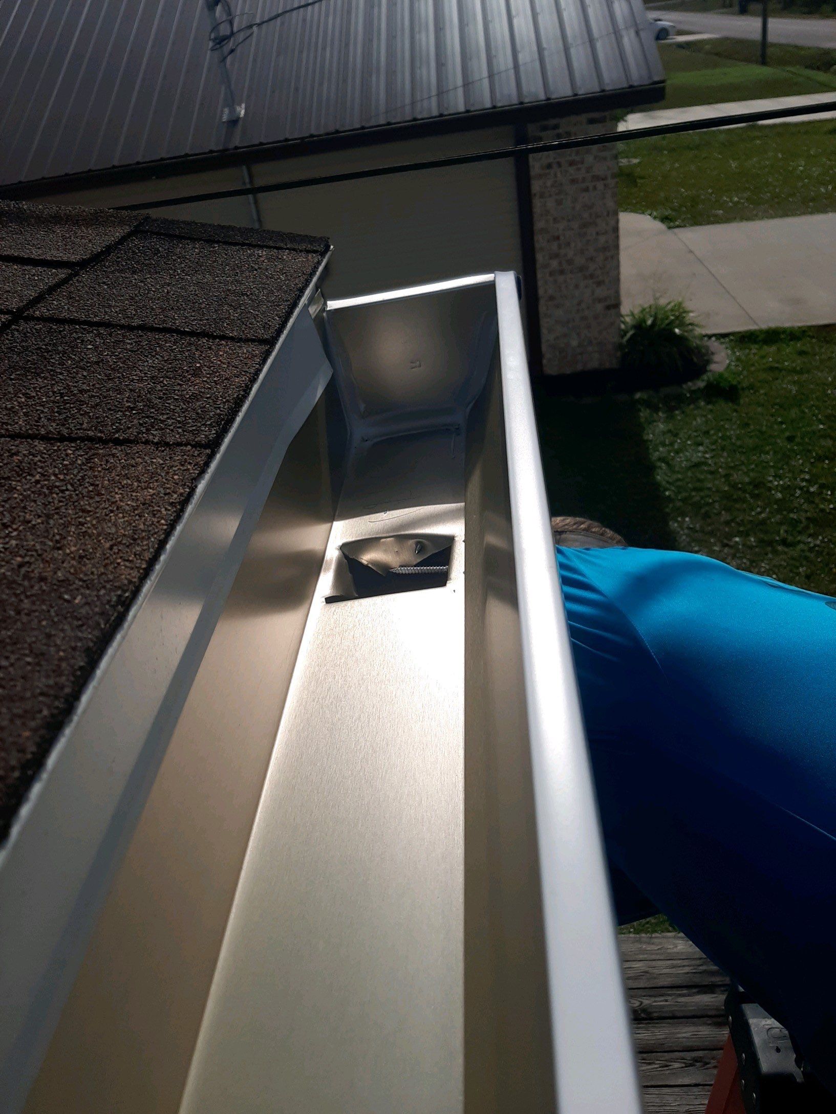 Gutter Installation using White Seamless Gutters by Gutter Professors