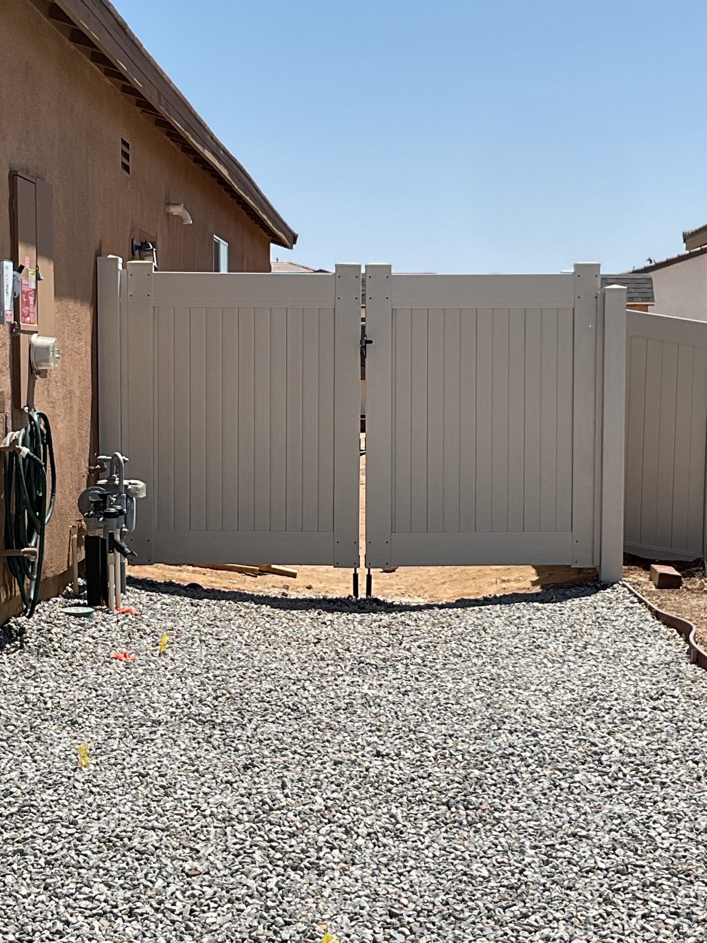 Gate installation using Vinyl by Fence Guys Inc. 
