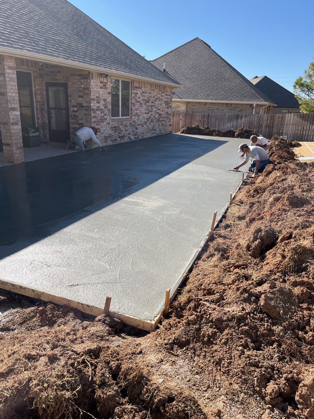 Concrete Slab , Retaining Wall , Fence, and landscape. by Clays Services Inc
