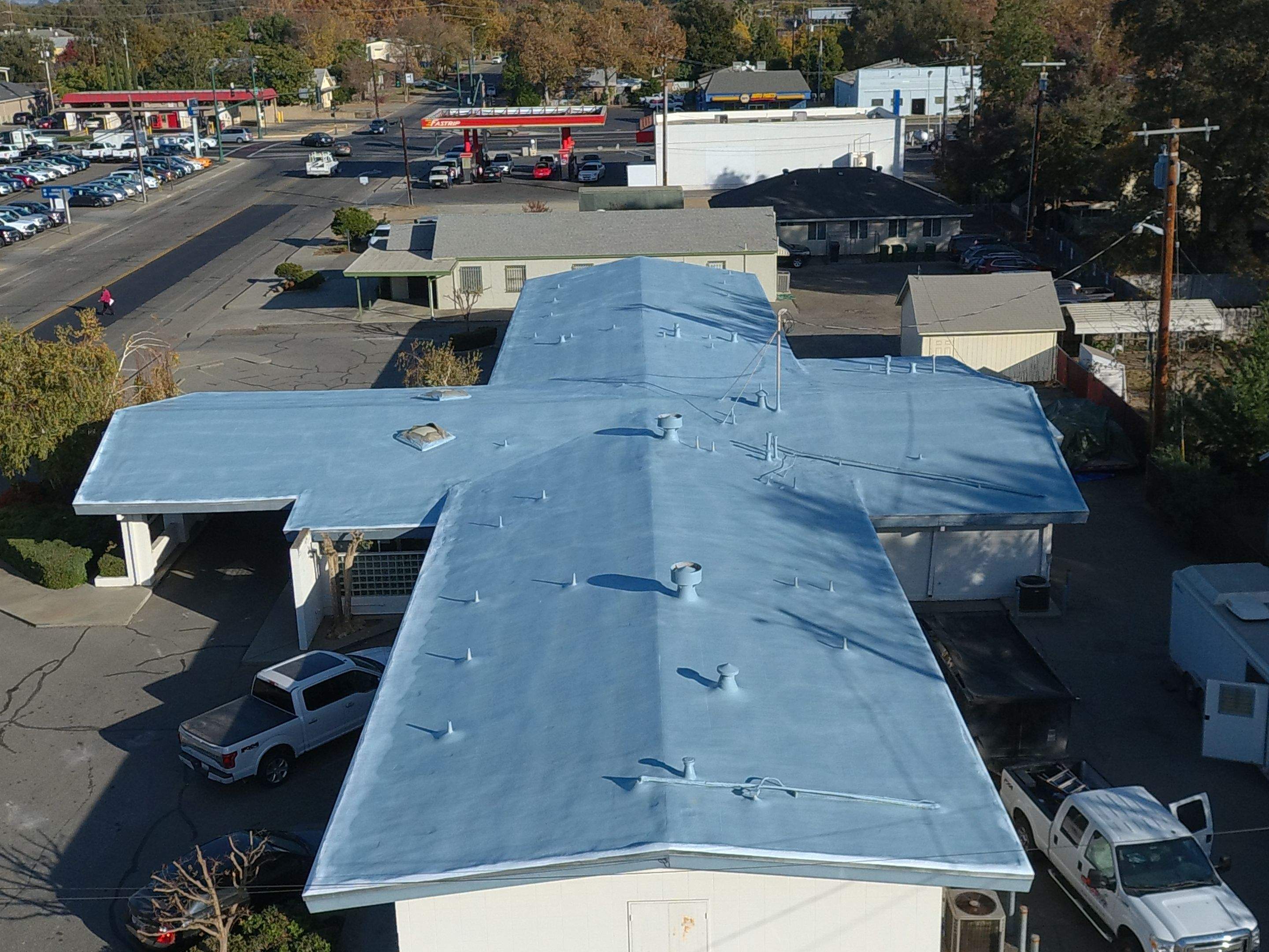 Spray foam and coatings using Conklin Benchmark/PUMA XL coatings and spray foam by Straight Edge Roofing Inc