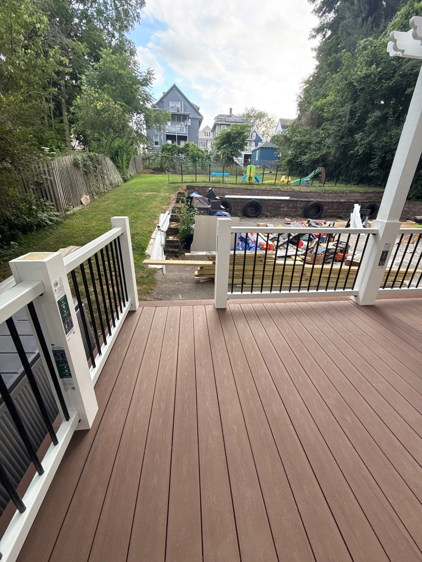 new deck with custom pergola by CabralCarpentry & Painting LLC
