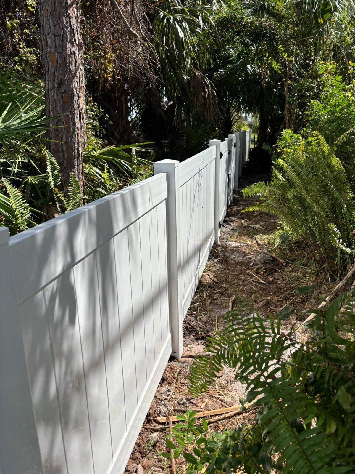 White Vinyl Privacy Fence and Gate Installation in North Port by True Fence LLC