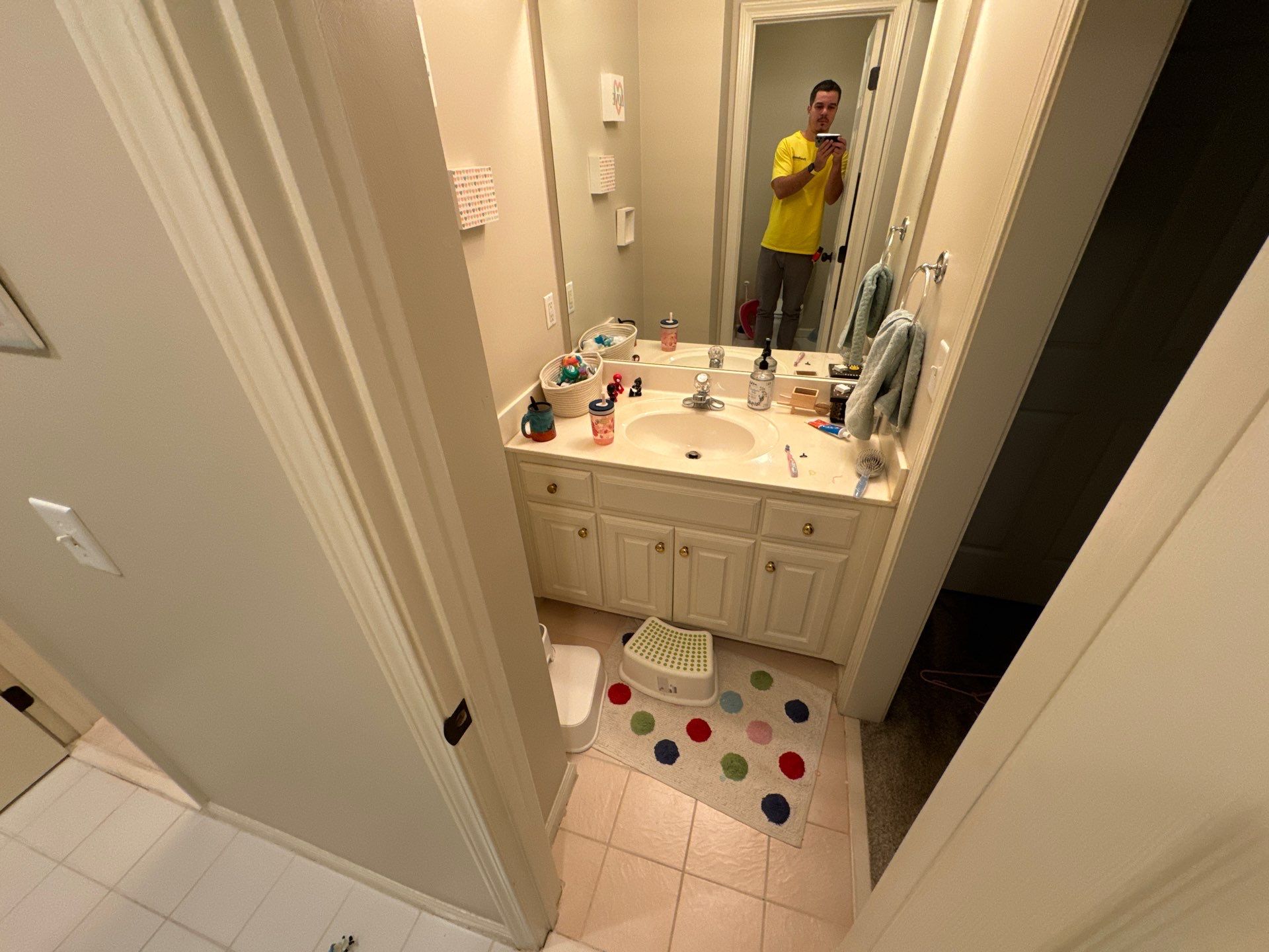 Tub retile, floor, vanities, mirror, and lights by Prudencio
