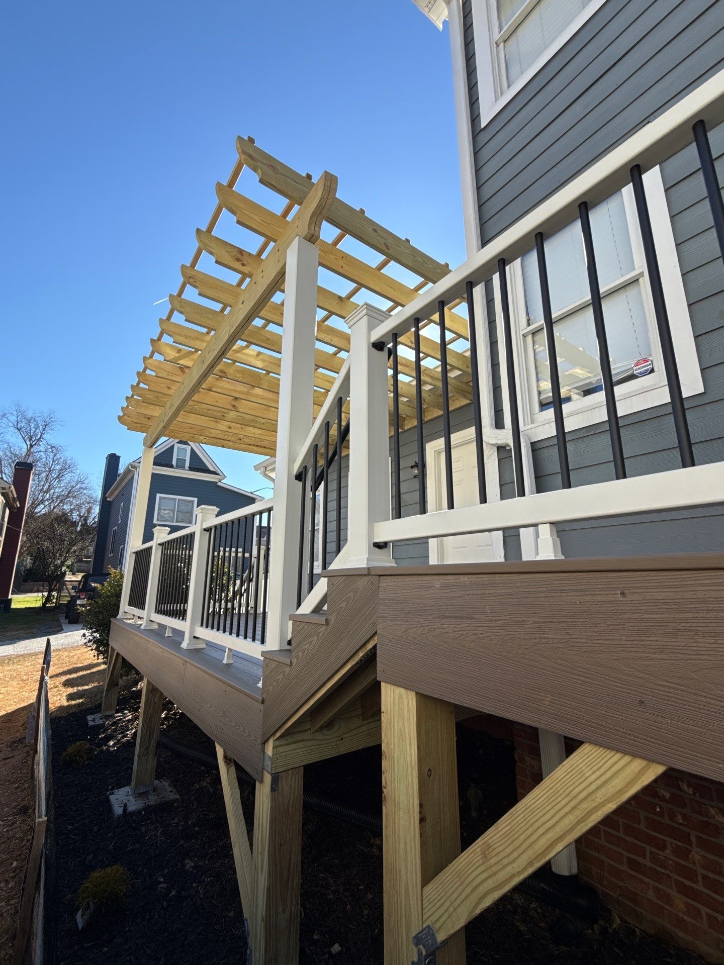 Atlanta, GA Deck Rebuild and Pergola Build using Deckorators Venture Series Decking, Trex Composite Railing, and Pressure Treated Pine by Nelson Exteriors 