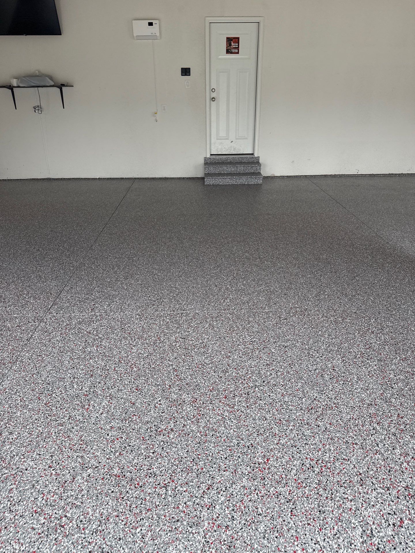 Custom Flake Garage Floor Coating Installation in Altoona by Revival Concrete Coatings