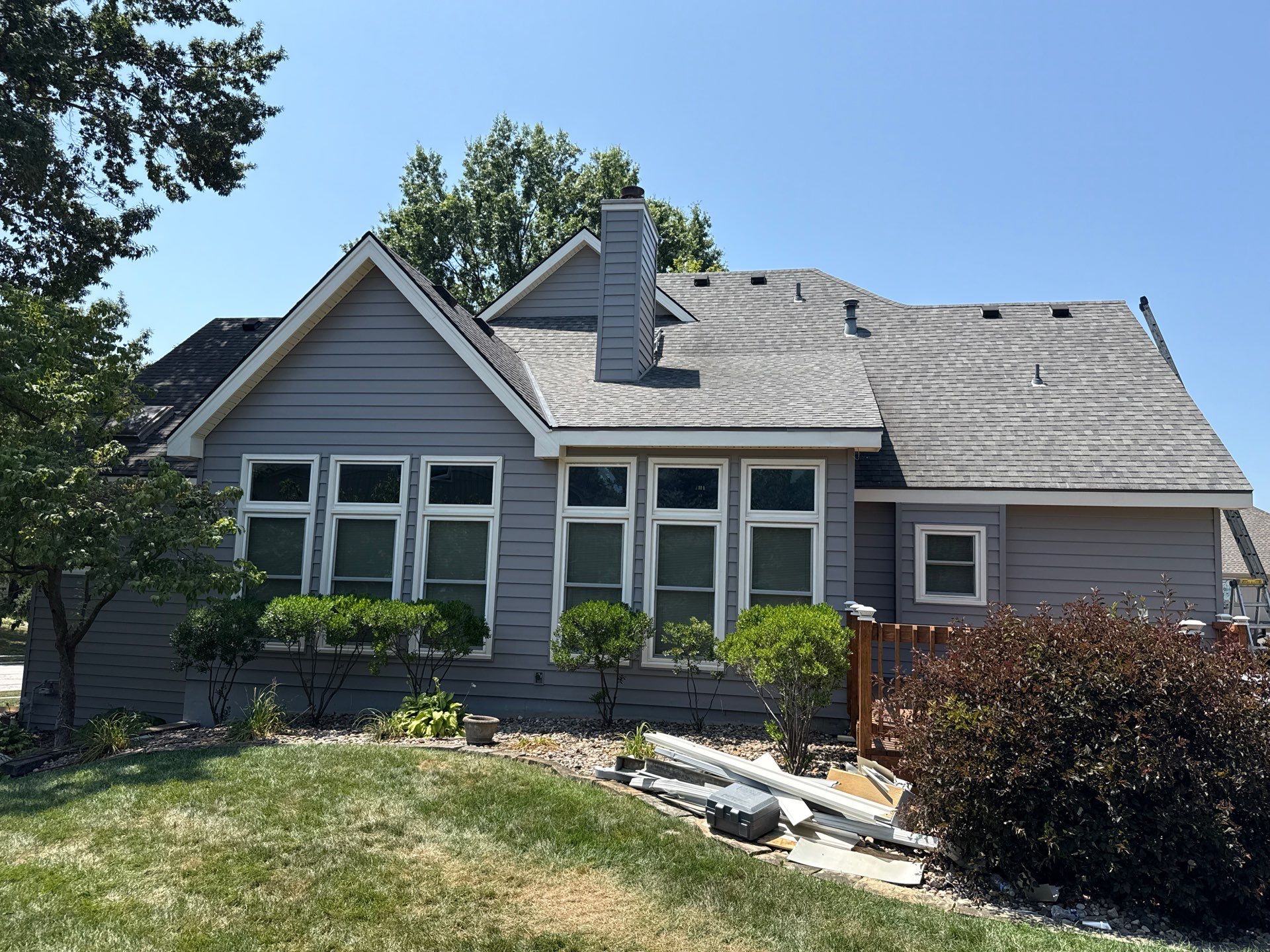 Whole Home Siding Replacement and Gutter Installation in Gladstone by EEC  Windows, Siding & Roofing 