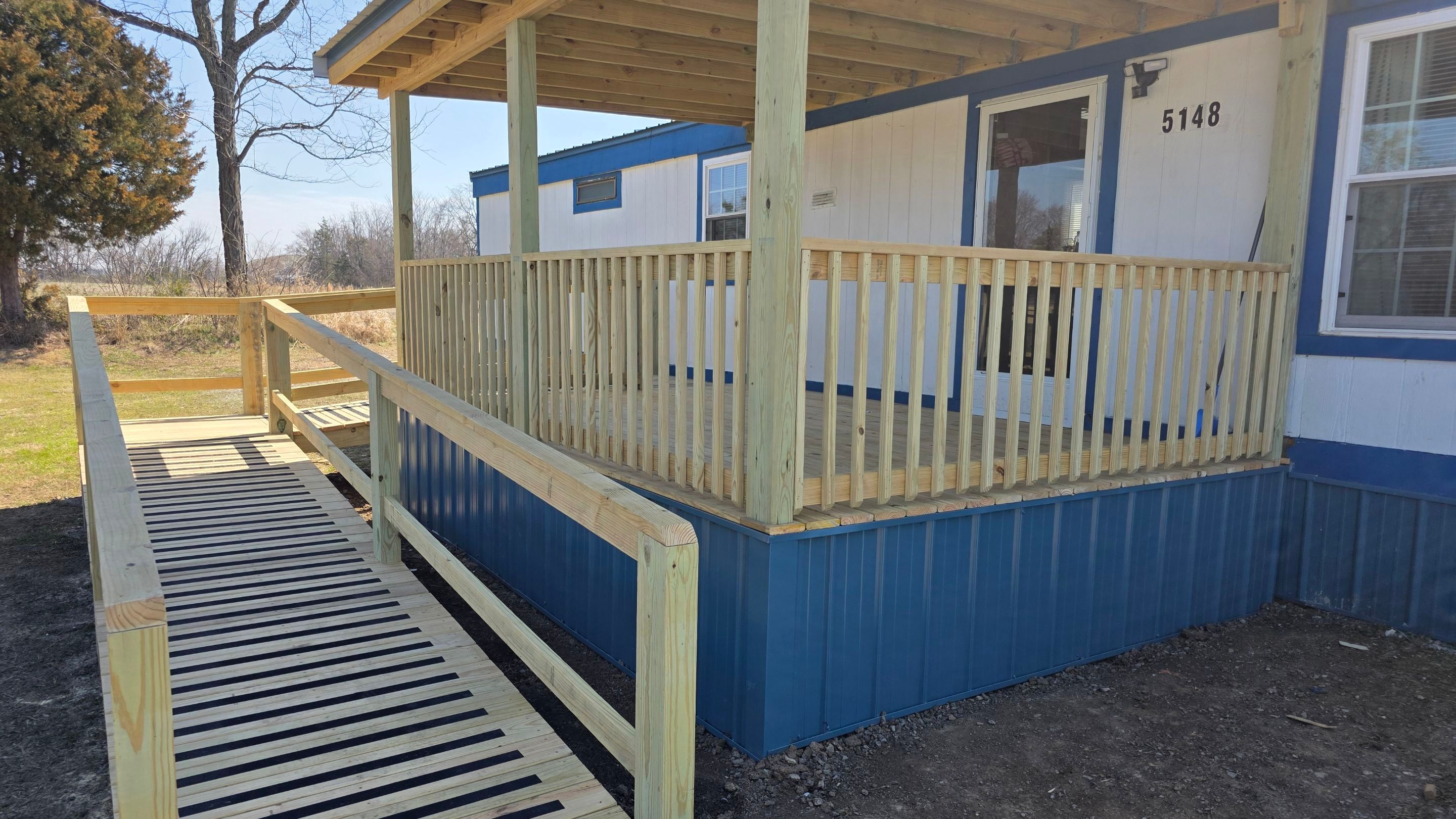 Covered Deck w/ ADA Ramp by In & Out Construction & Remodeling, LLC