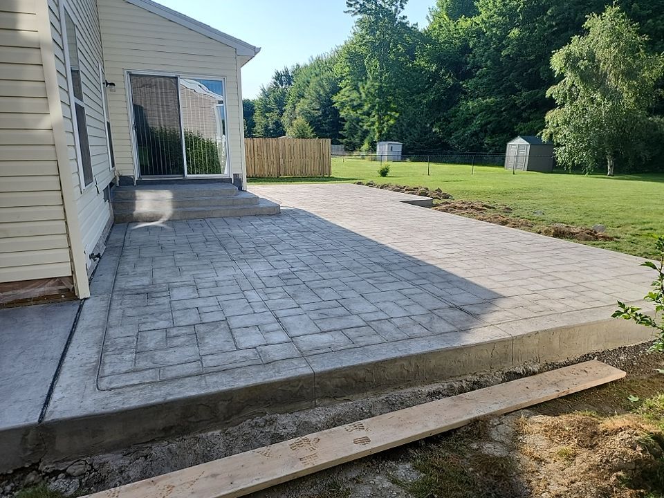 Stamped Concrete, Entry Door, and Concrete  by Ivy Lea Construction