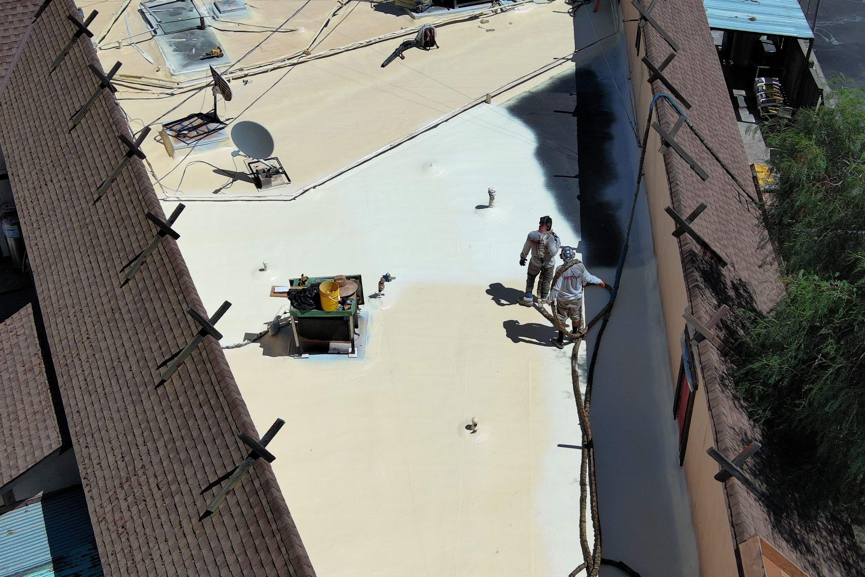 Spray foam and coatings using General Coatings acrylic coatings and spray foam by Straight Edge Roofing Inc