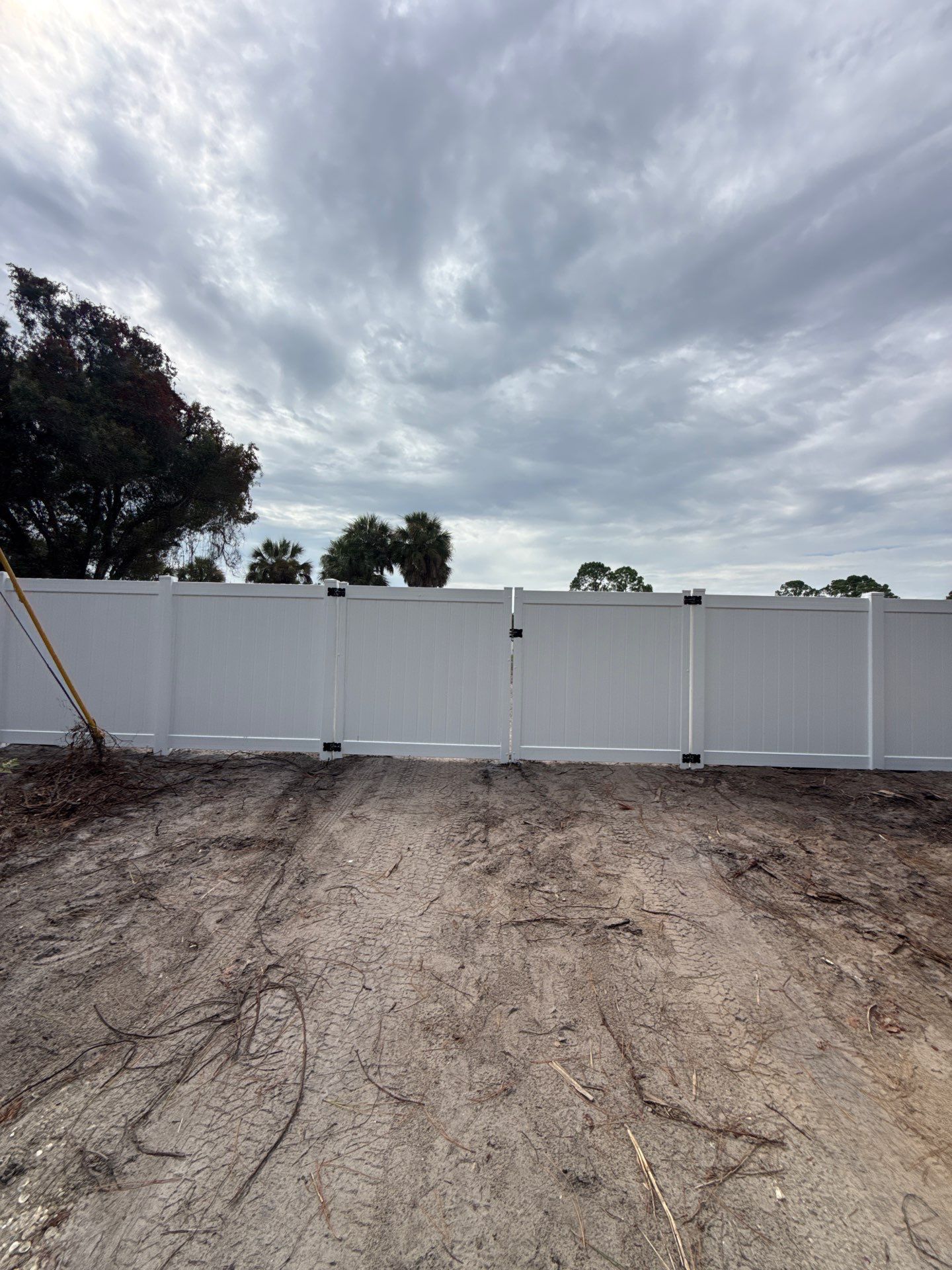 White Vinyl Privacy Fence Installation in North Port Florida by True Fence LLC