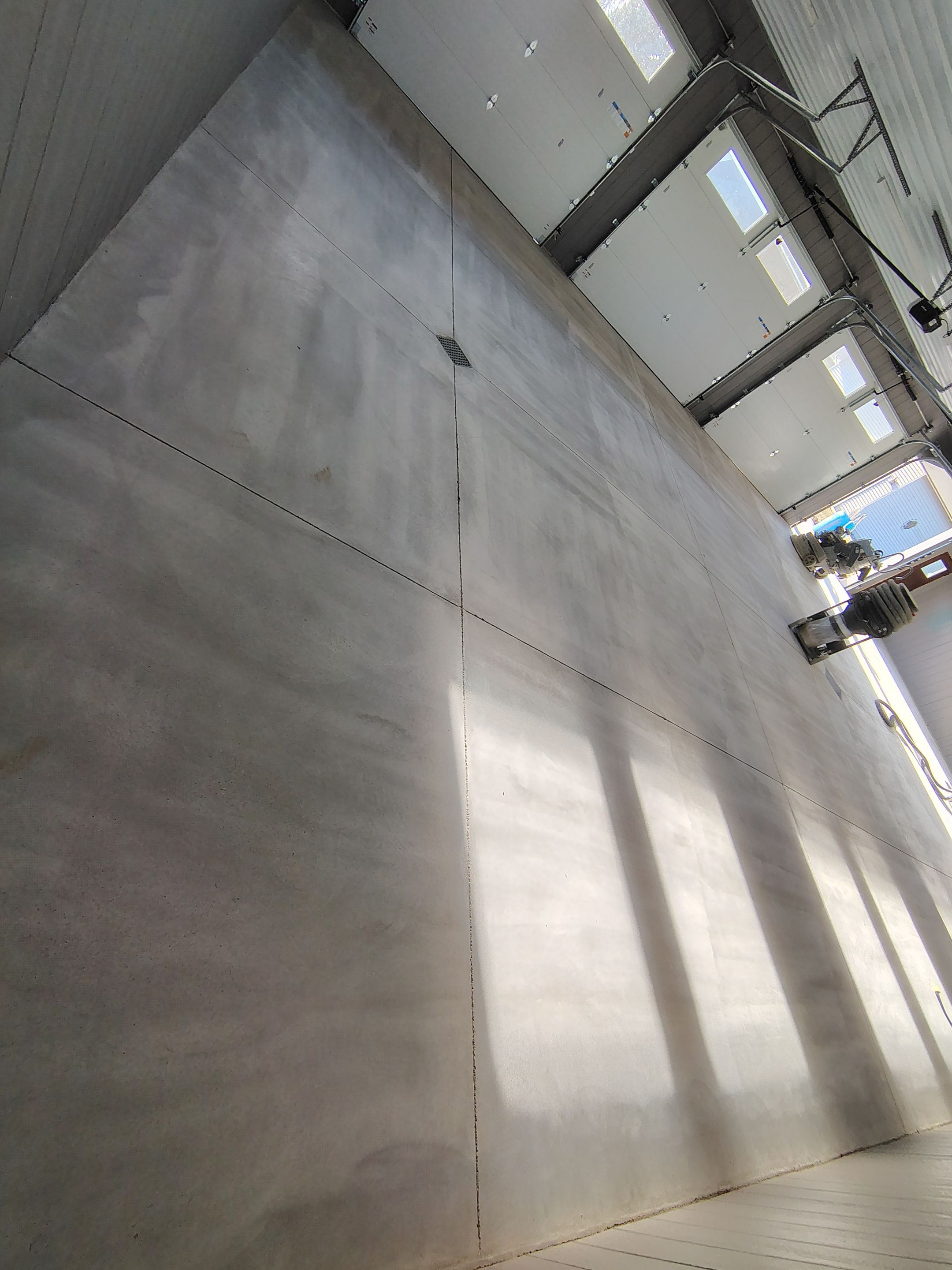 Speckled Epoxy Floor Coating for Large Shop in Rock Valley by Select Painting, Coatings & Garage Cabinets