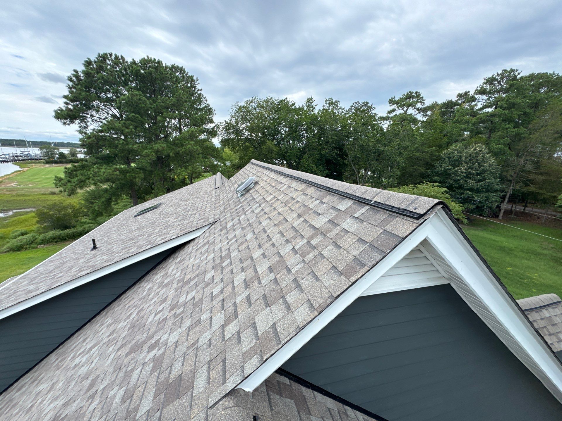 Roof Replacement and White Gutter Installation in Gloucester by Cade Construction