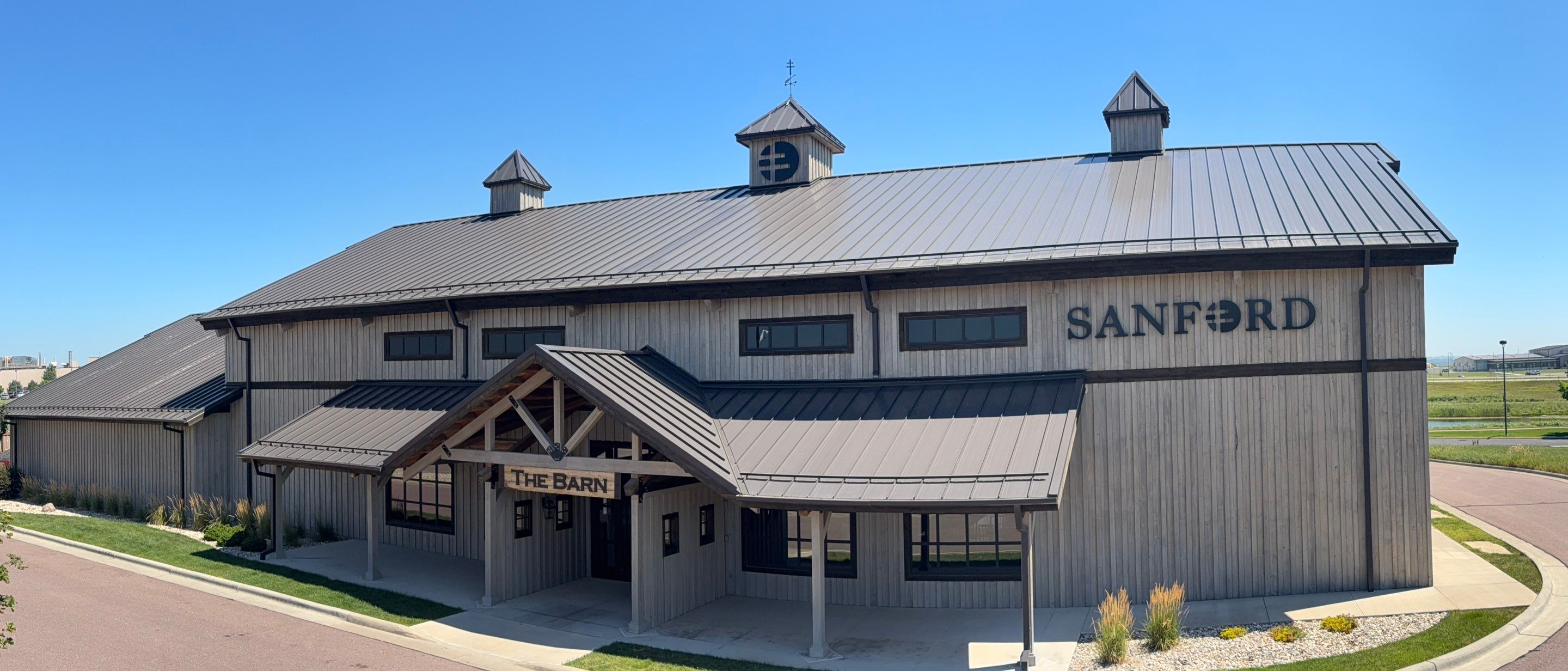 Commercial Exterior Wood Staining for Sanford Barn in Sioux Falls by Select Painting, Coatings & Garage Cabinets