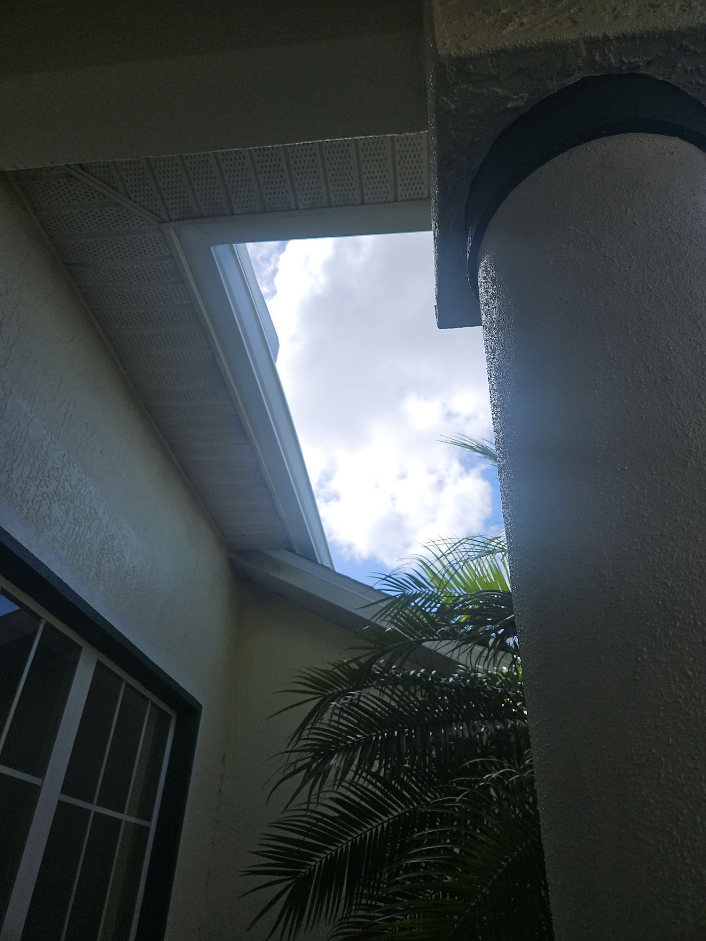 White seamless Gutters and downspout repair in Sarasota FL by Gutter Professors
