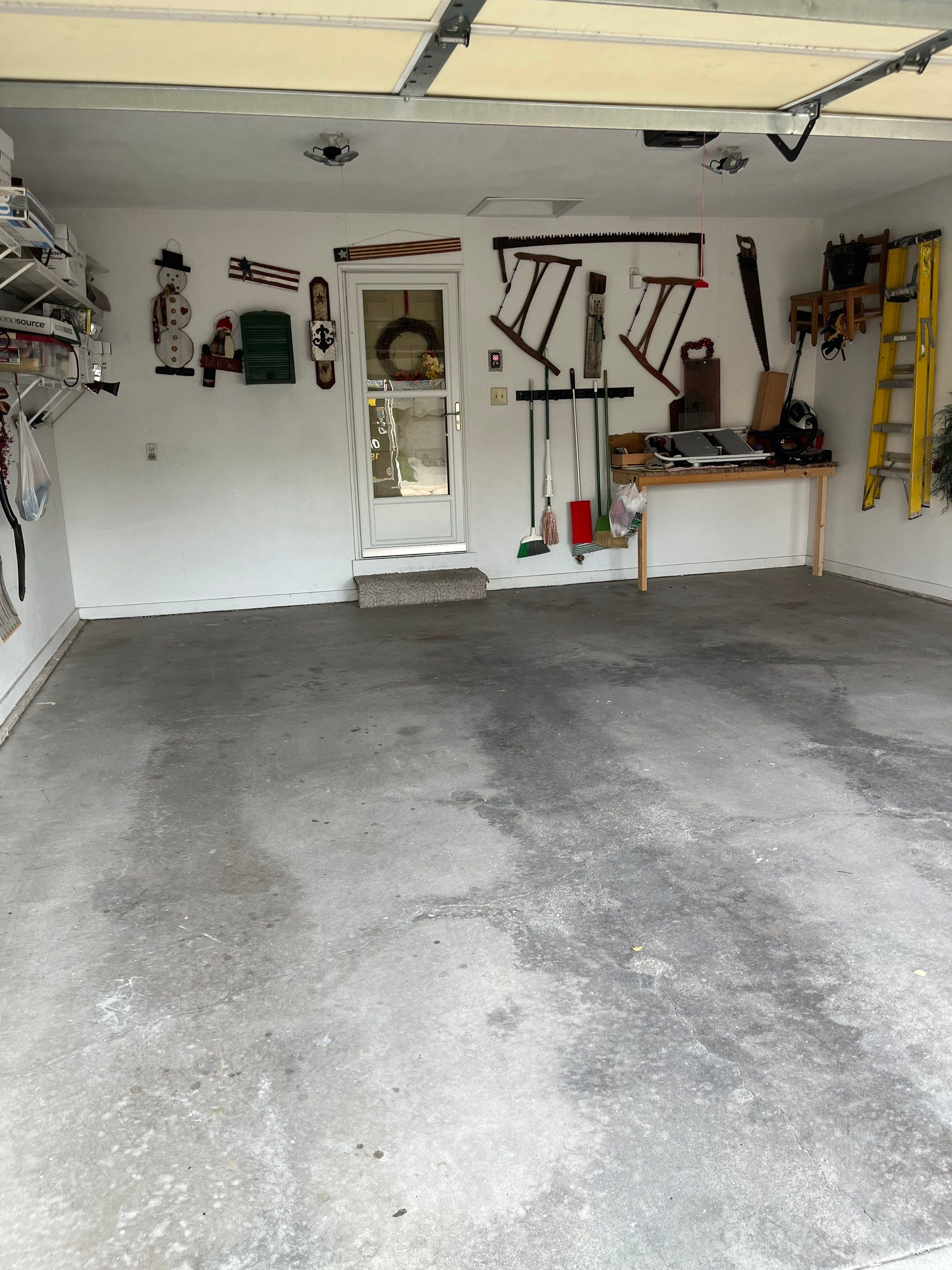 West Des Moines Garage and Patio Floor Coating using Pebble Beach Flakes by Revival Concrete Coatings