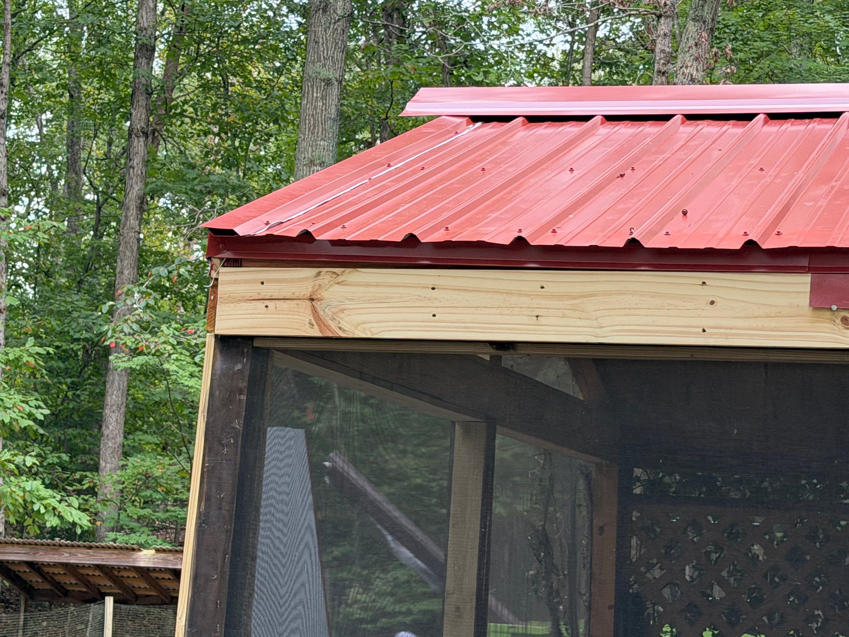 Red Metal Roof Restoration and Wood Fascia Replacement in Barboursville by Cade Construction
