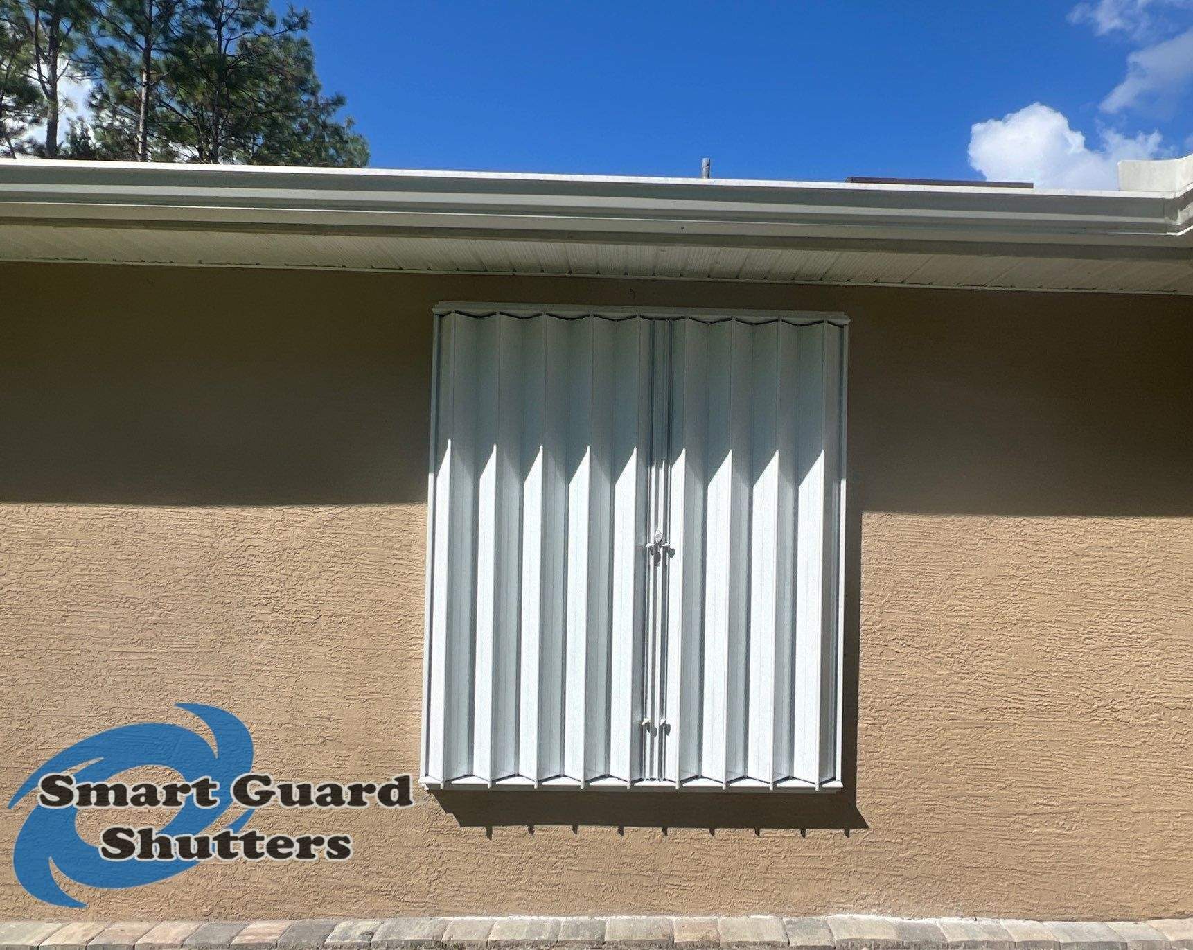 Accordion Shutters in White by Smart Guard Shutters