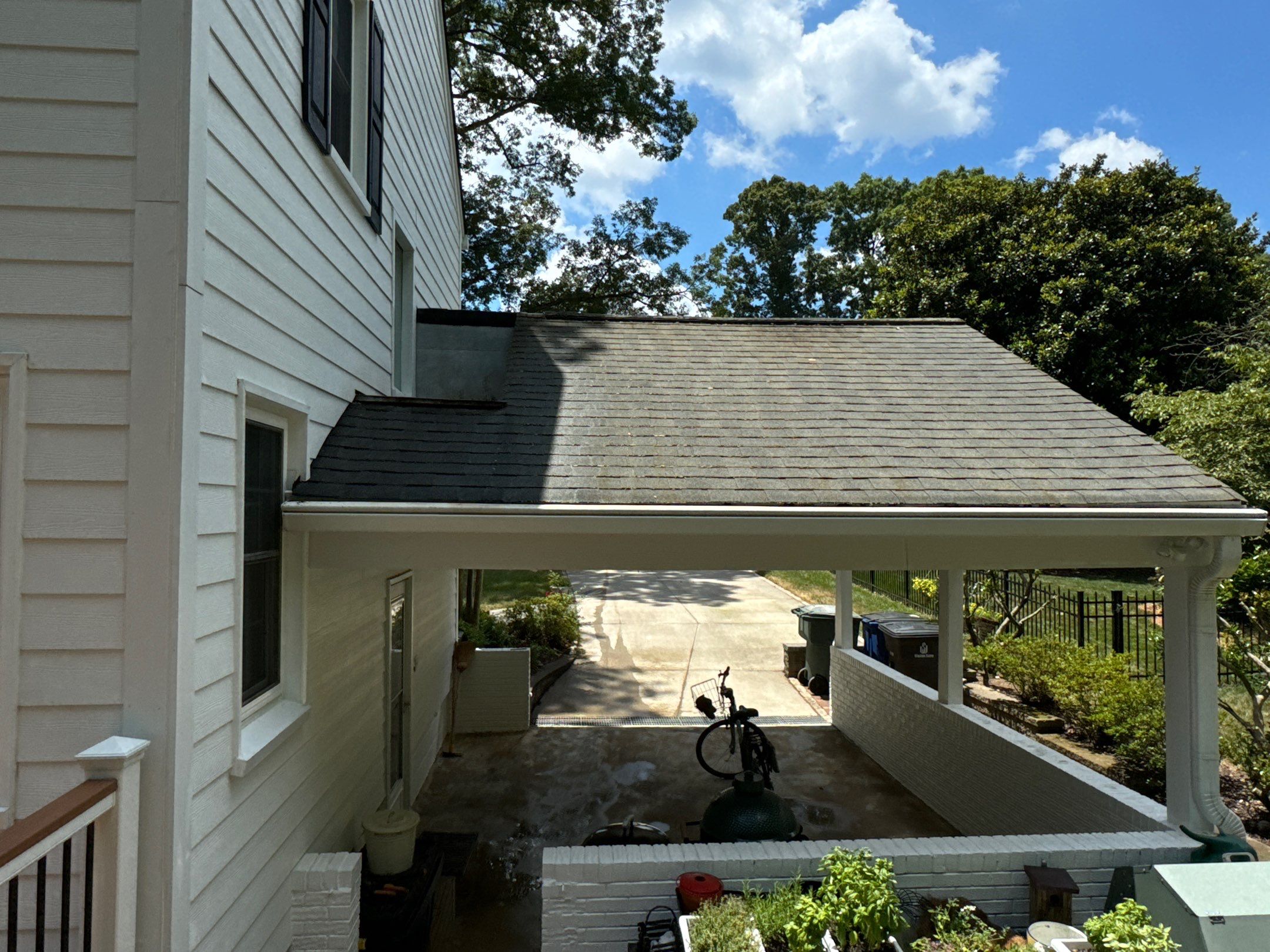 pressure washing company cleaning house siding roof and driveway surfaces in winston salem nc