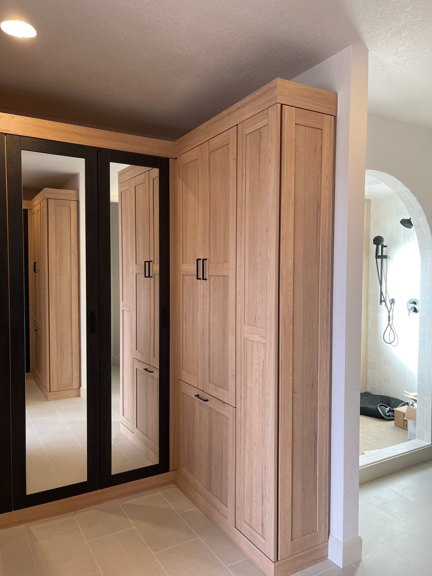 Two-Tone Closet with matching Mudroom + Laundry Room by Concept 32, Inc.