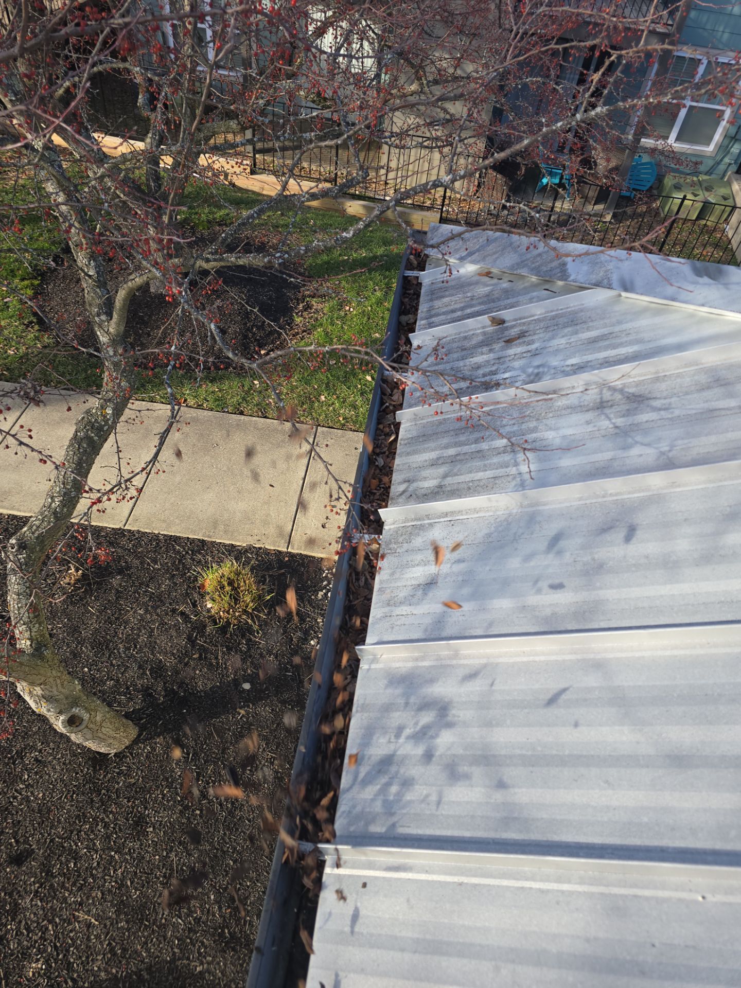 Commercial gutter cleaning Lexington before photo with filled gutters