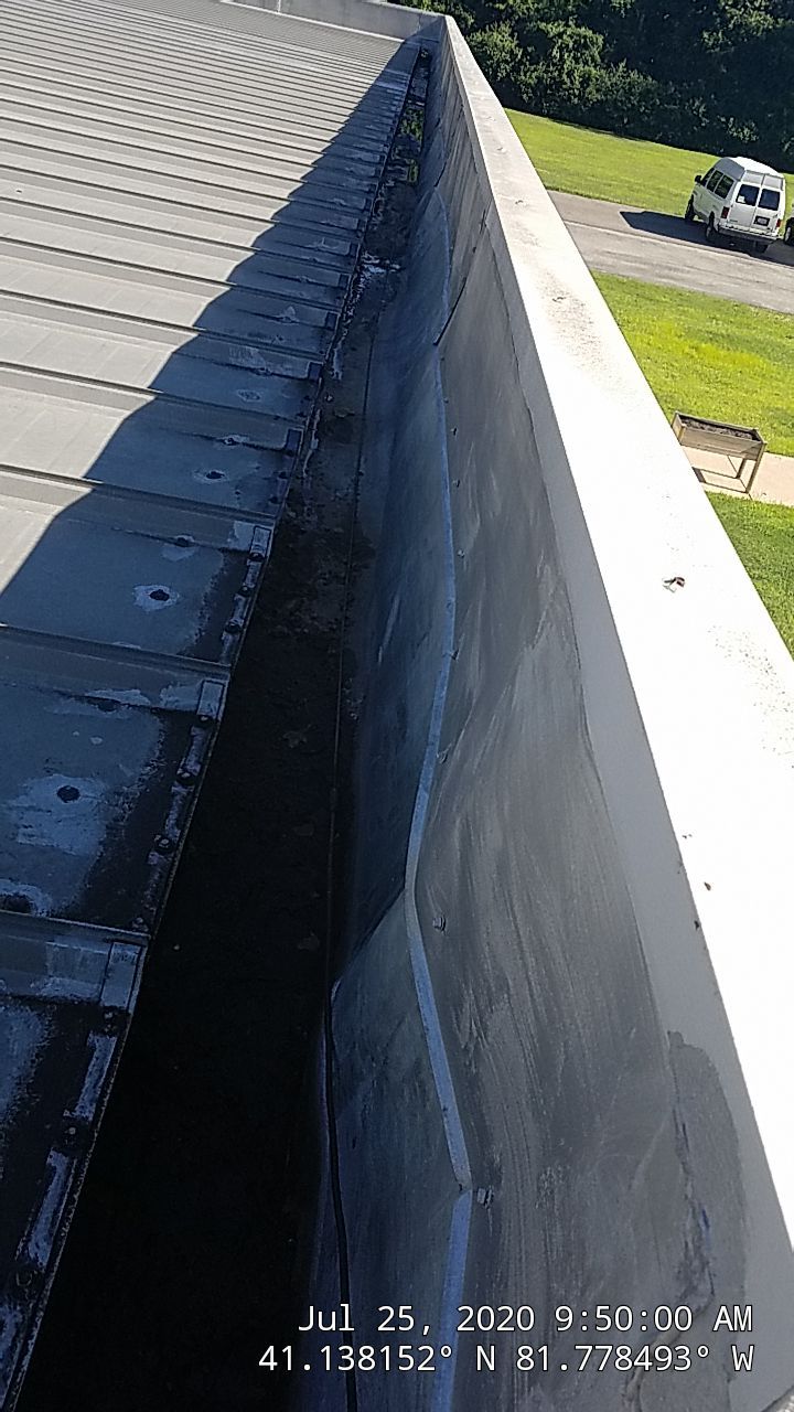 Commercial Metal Roof Coating by Gold Star Roofing LLC