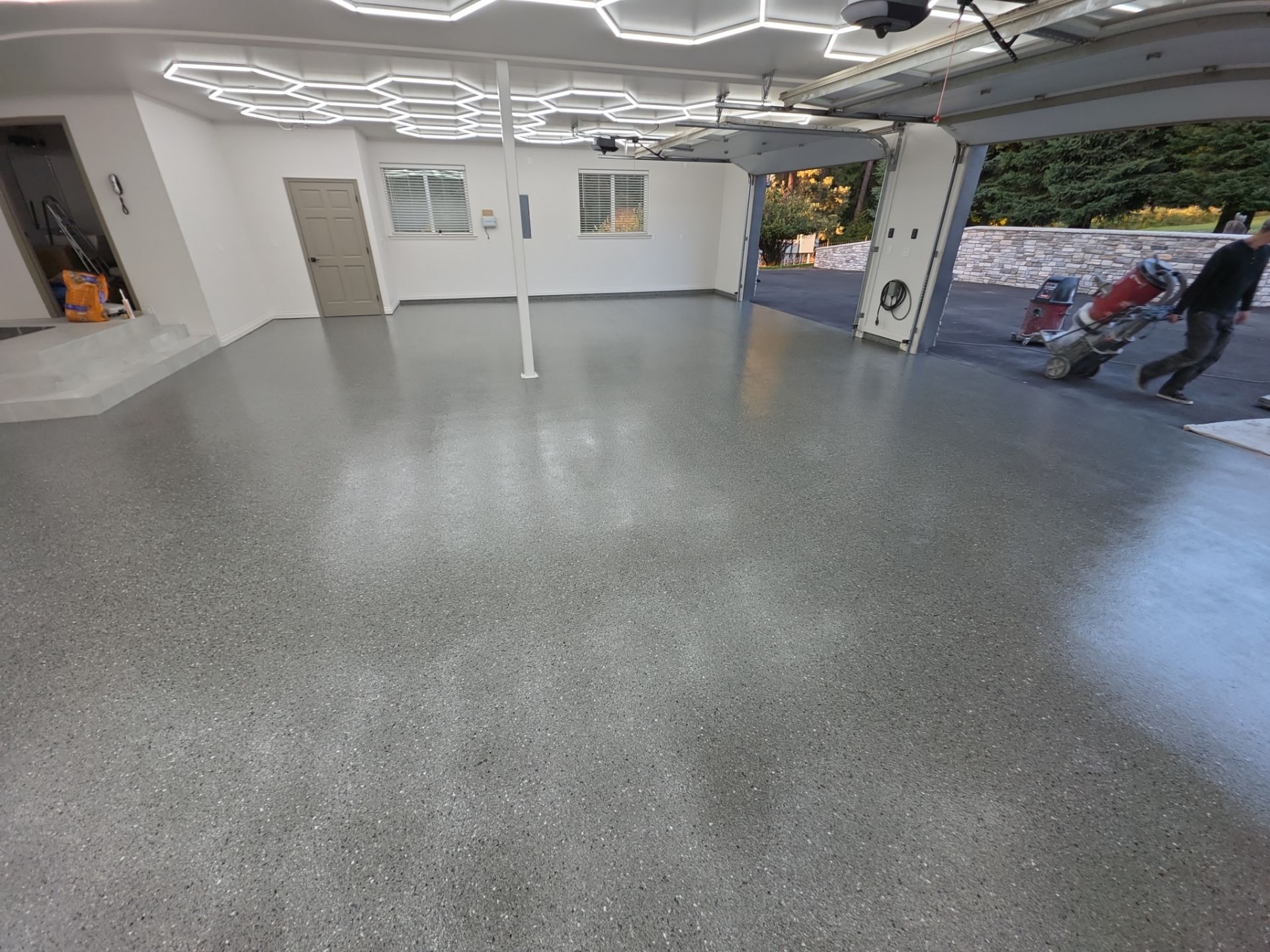 Custom Garage Transformation with Polyaspartic Coating and Hexagonal LED Lighting by Croc Coatings, LLC
