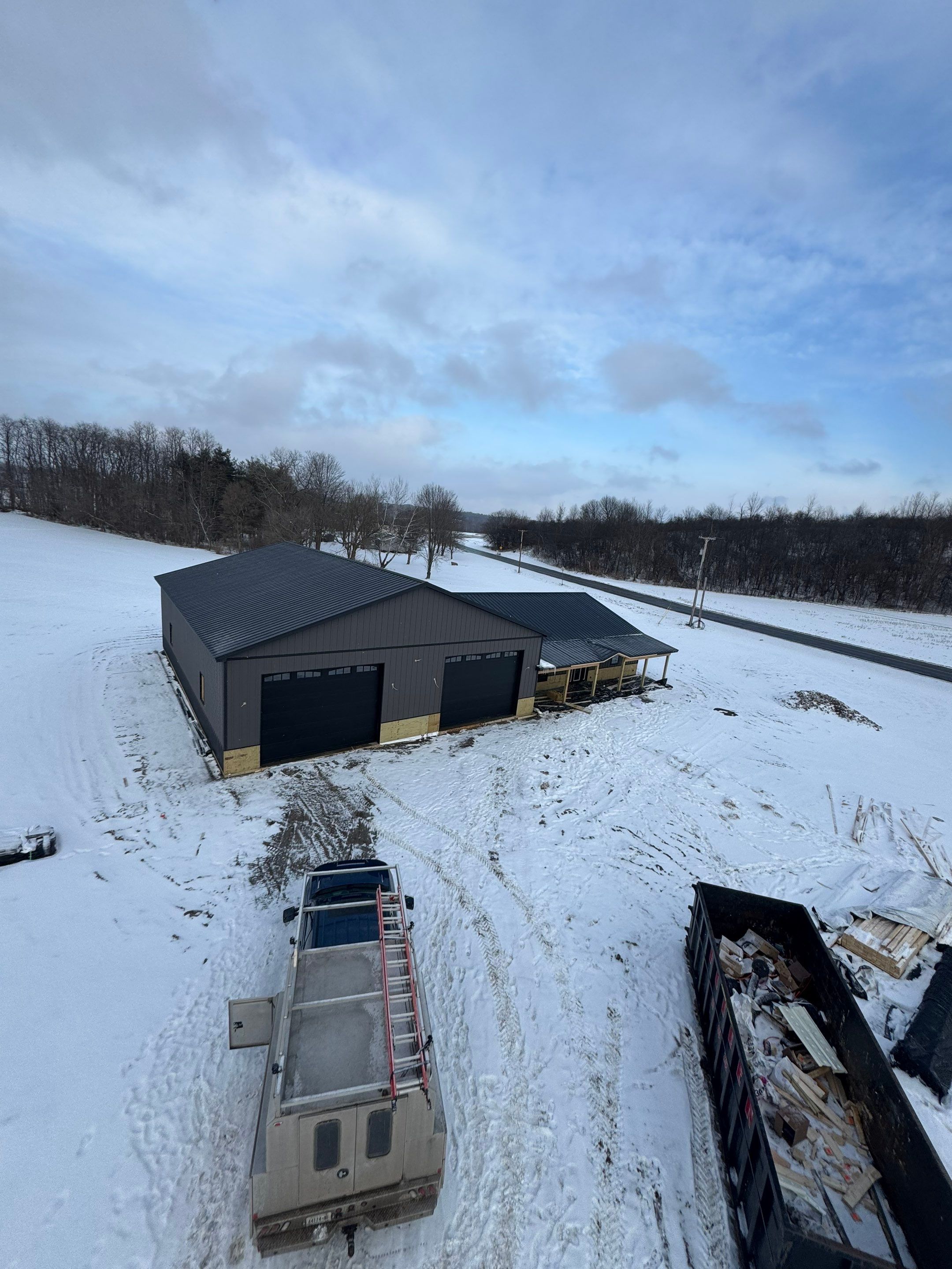 Barndominium  using Textured Board & Batton by Horst Custom Homes 
