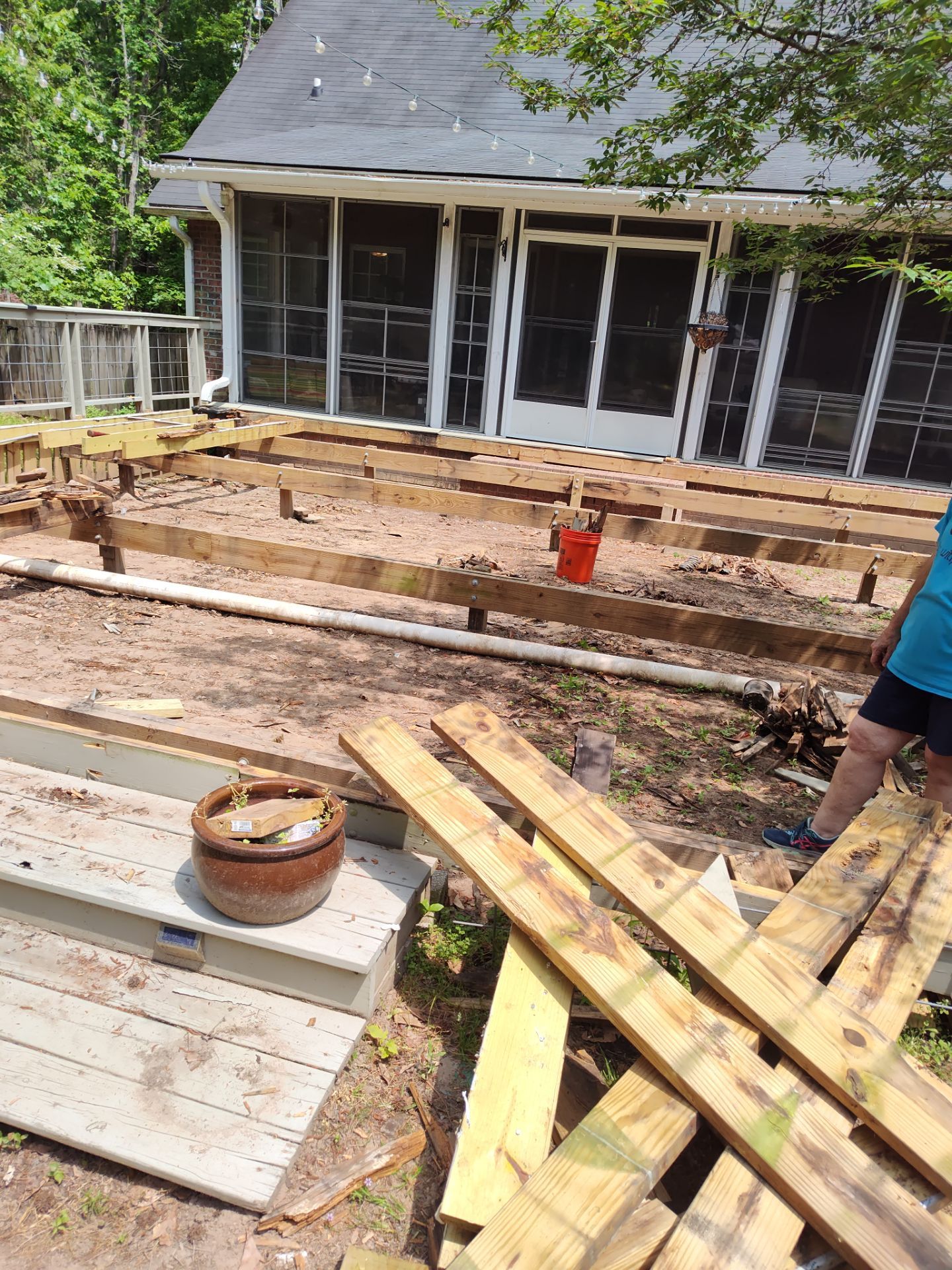 Patio in concrete with drainage improvements by Cornerstone Home Builders, LLC